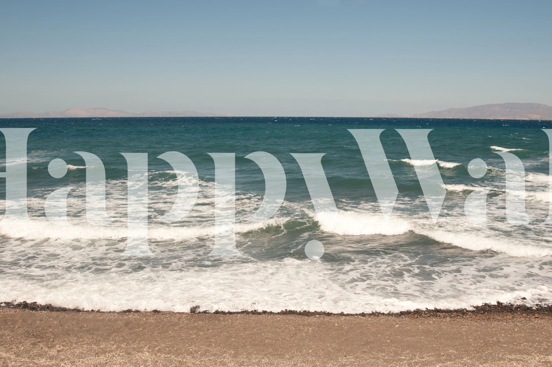 Ocean waves crashing on a sandy beach wallpaper