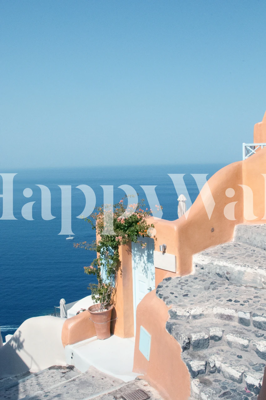 Santorini coastline with orange buildings and blue sea wallpaper