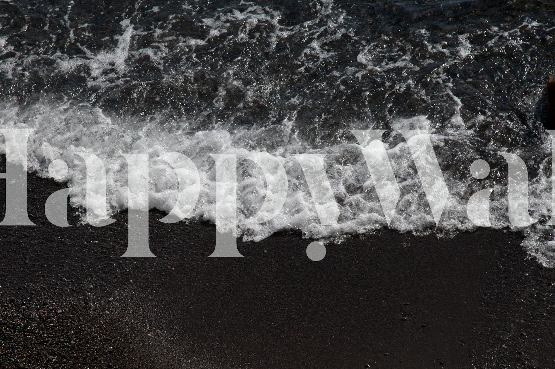 Ocean waves crashing on dark beach wallpaper