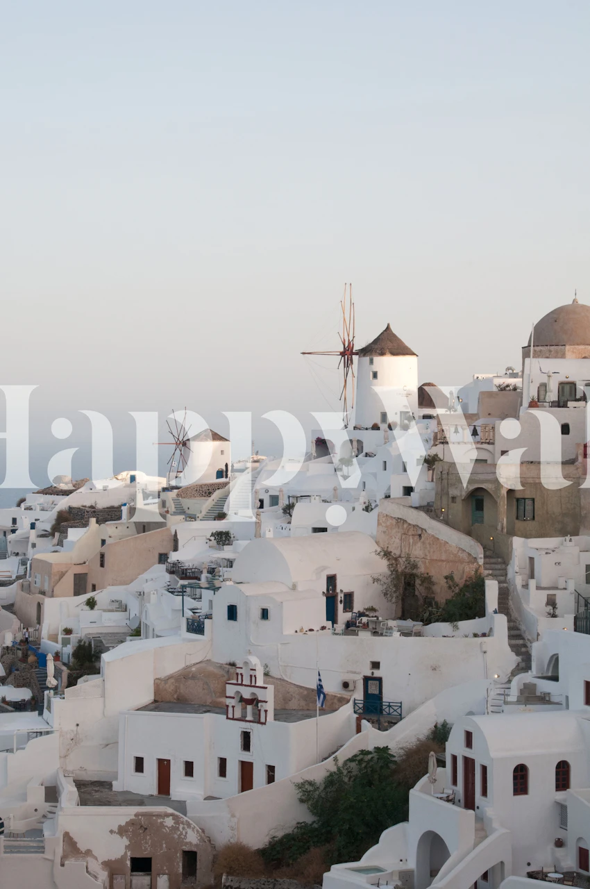 Santorini sunset view with white buildings and windmills wallpaper