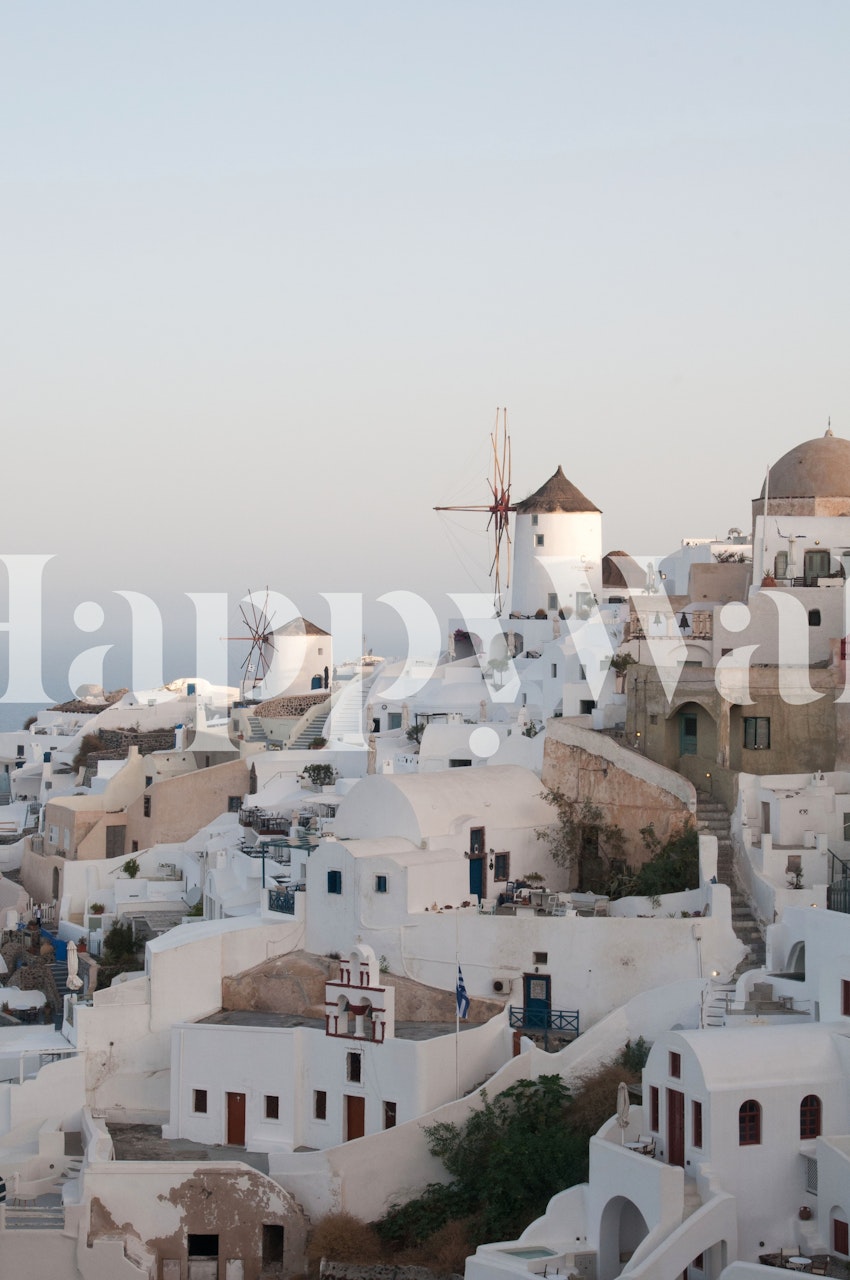 Santorini sunset view with white buildings and windmills wallpaper