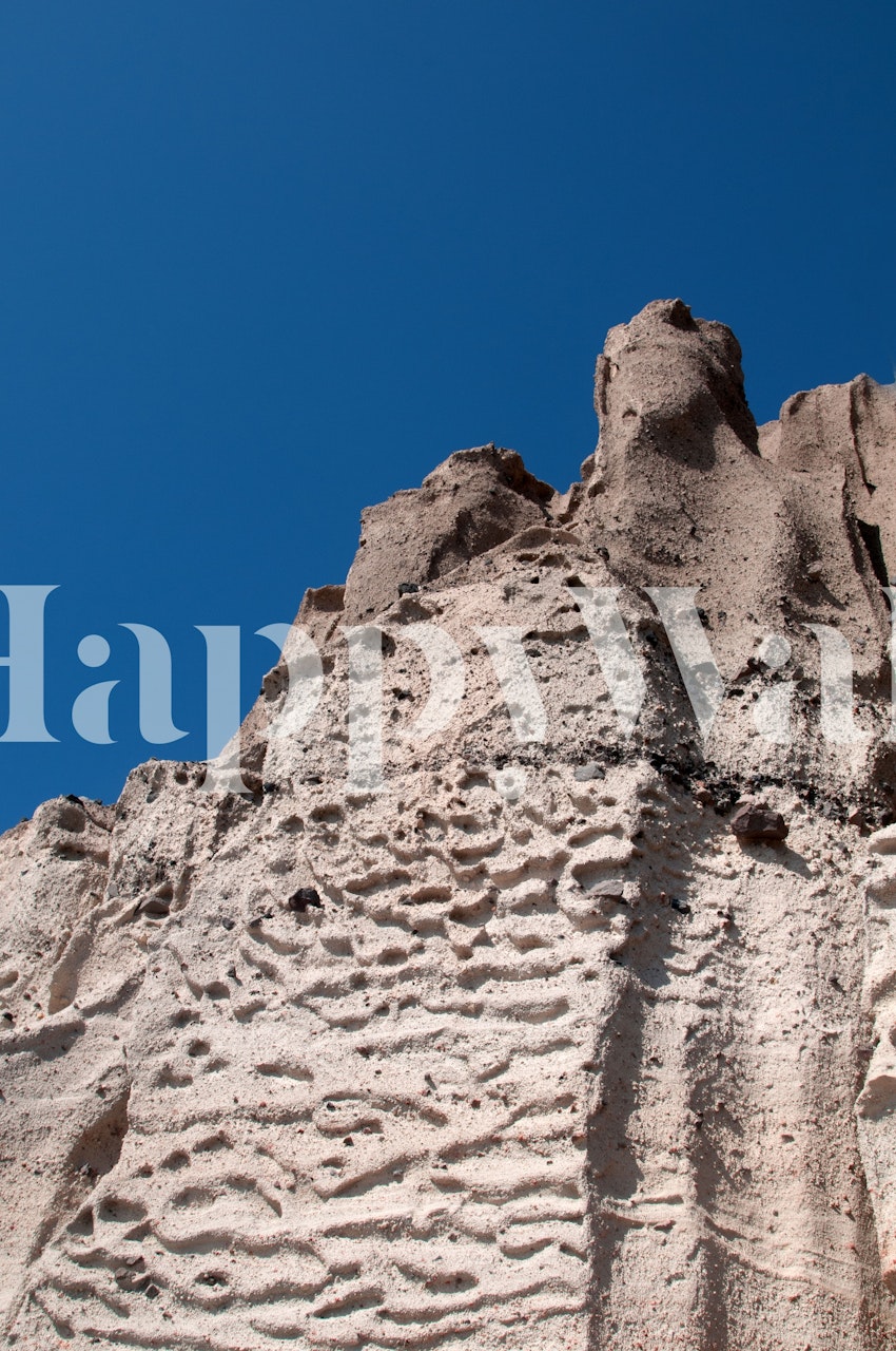 Santorini volcanic cliff wall mural with textured earthy tones