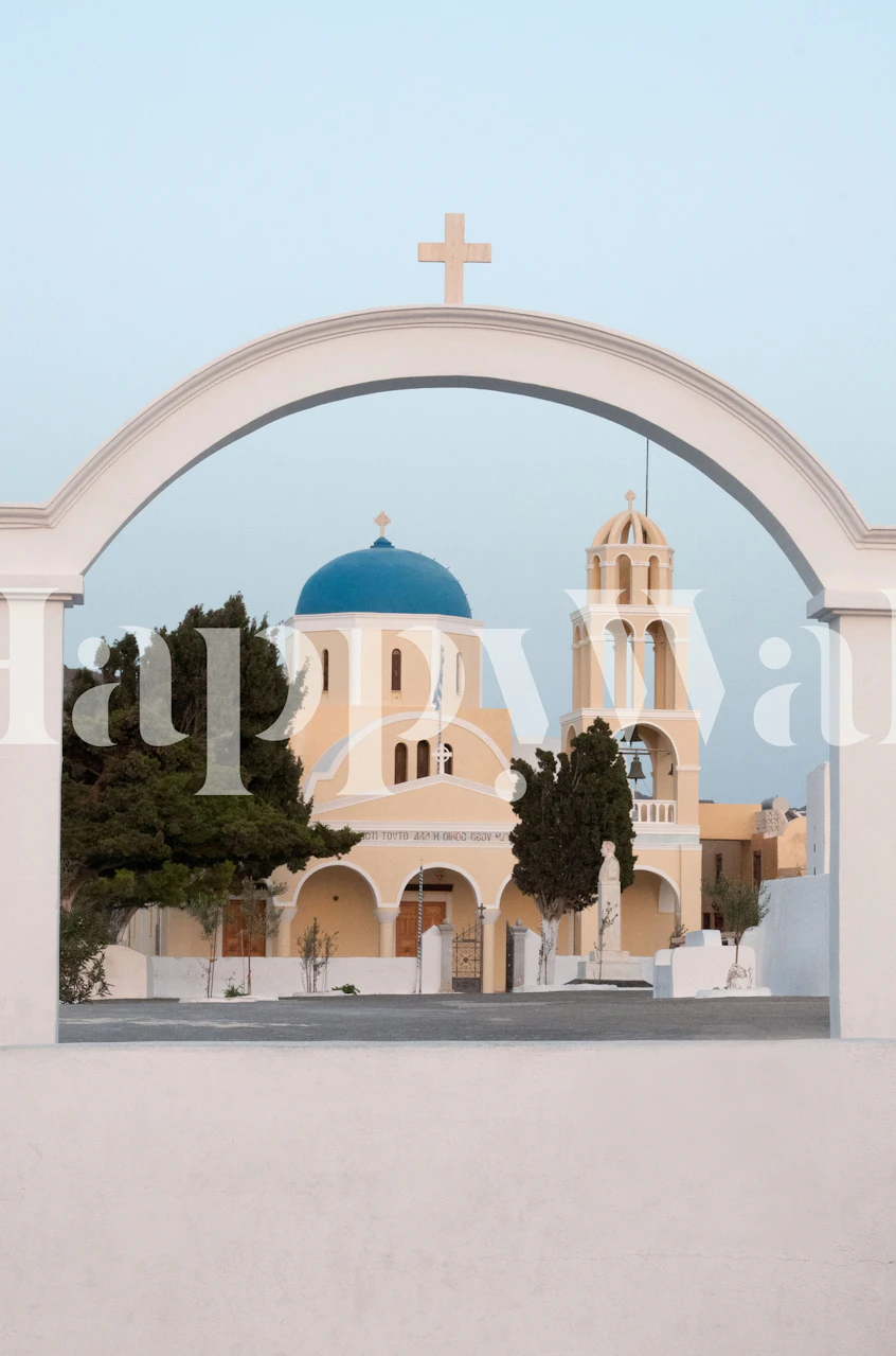 Santorini Oia village church with blue dome framed by an archway