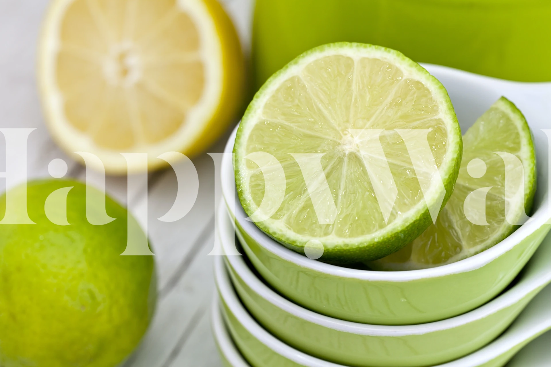 Sliced lemon and lime on green dishes with yellow background wallpaper