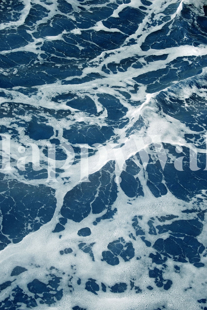 Atlantic ocean waves mural wallpaper with frothy white seafoam on deep blue water.