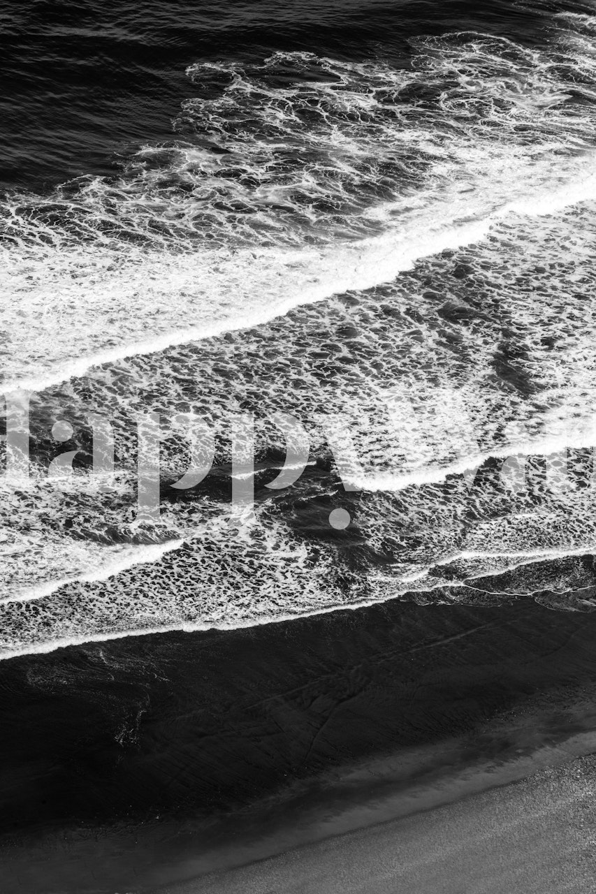 Black and white waves crashing on the shore wallpaper
