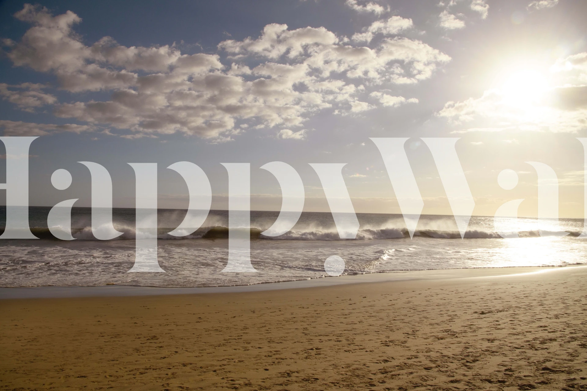 Beach scene with ocean waves, golden sand, and sunset colors wallpaper