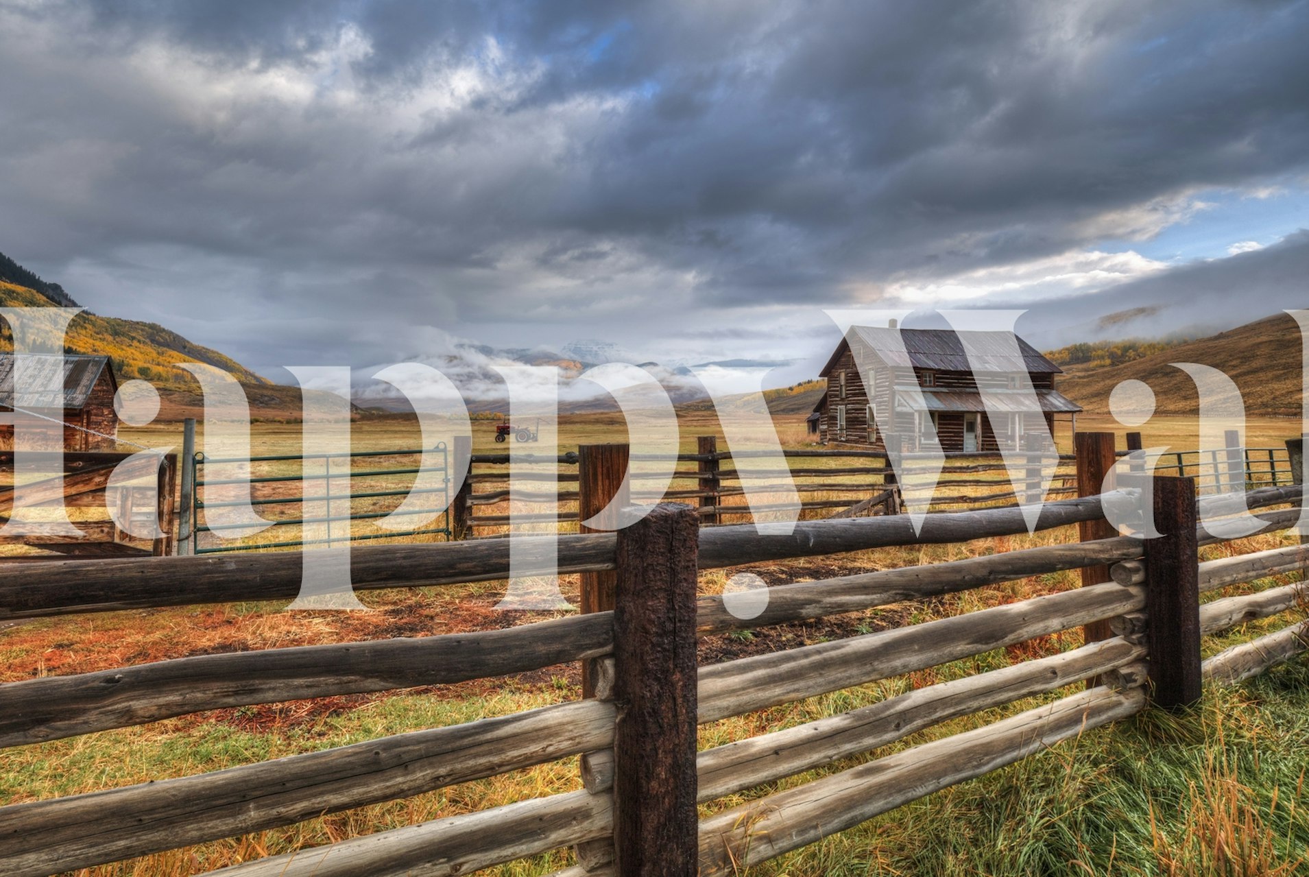 Rustic farmhouse scene wallpaper showcasing warm autumn colors and dramatic clouds.