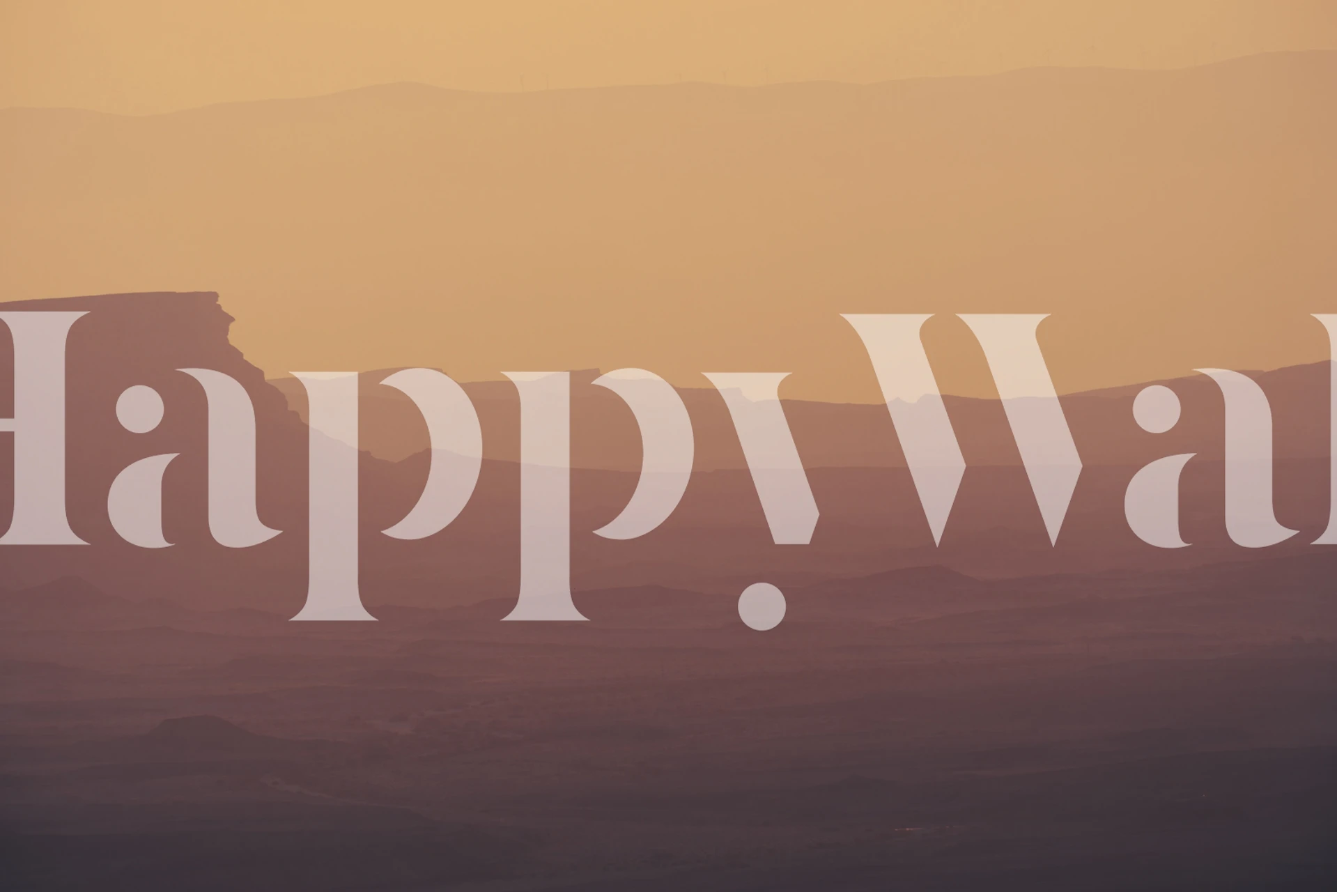 Desert silhouette at sunset with warm orange hues wallpaper