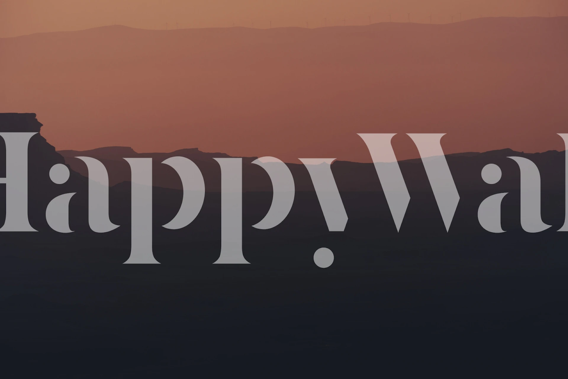 Wall mural of a sunrise over Ramon Crater with a gradient sky and silhouette landscape