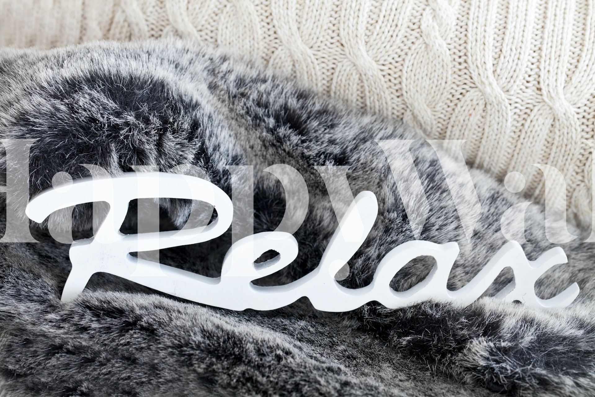 Gray faux fur wallpaper with white 'Relax' text
