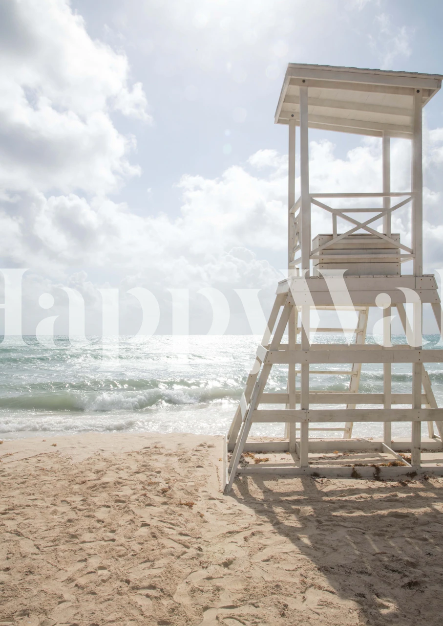 Caribbean beach scene with a white lifeguard tower on the sand and tranquil ocean backdrop