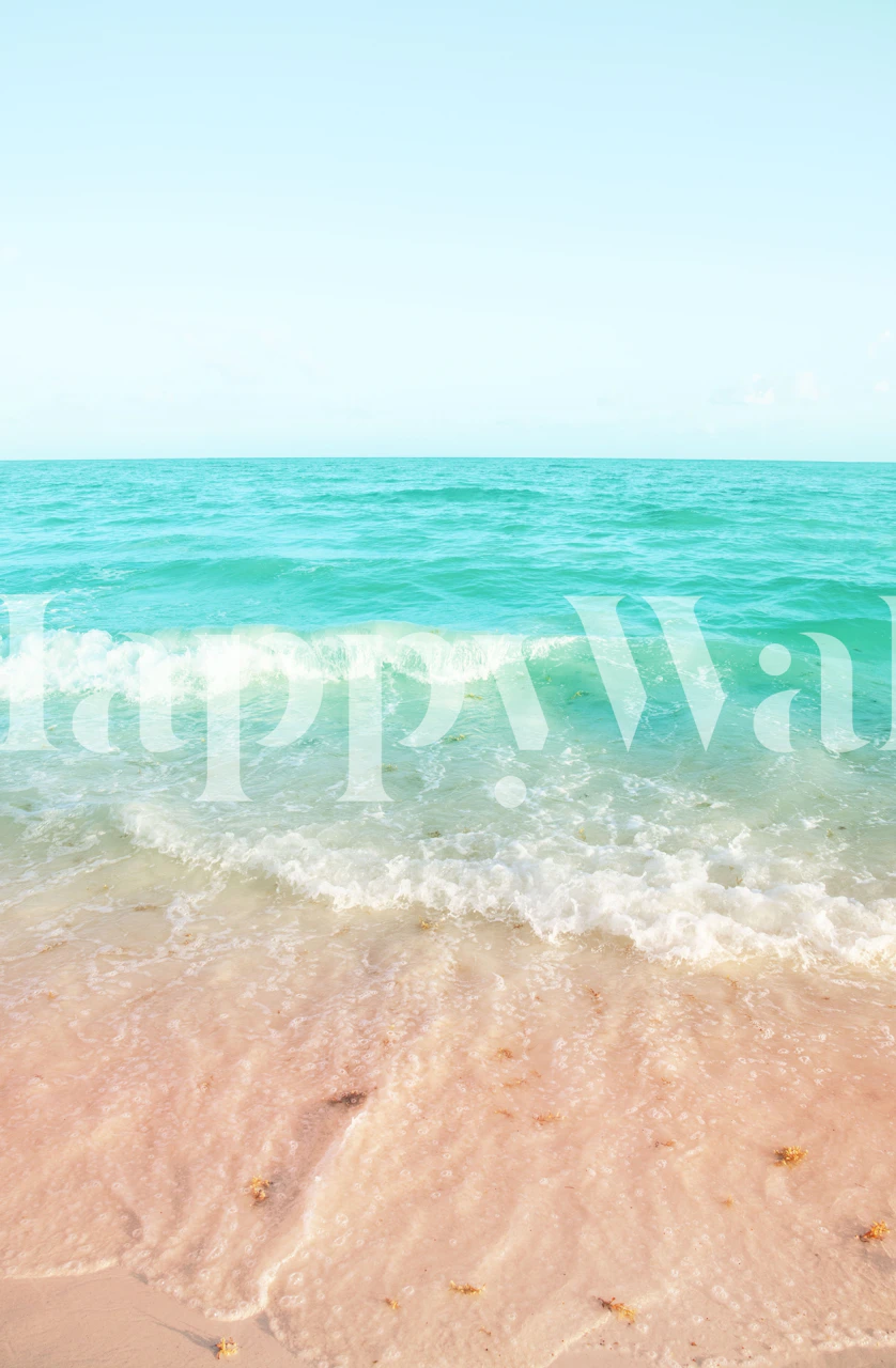 Turquoise ocean waves on a sandy beach wallpaper