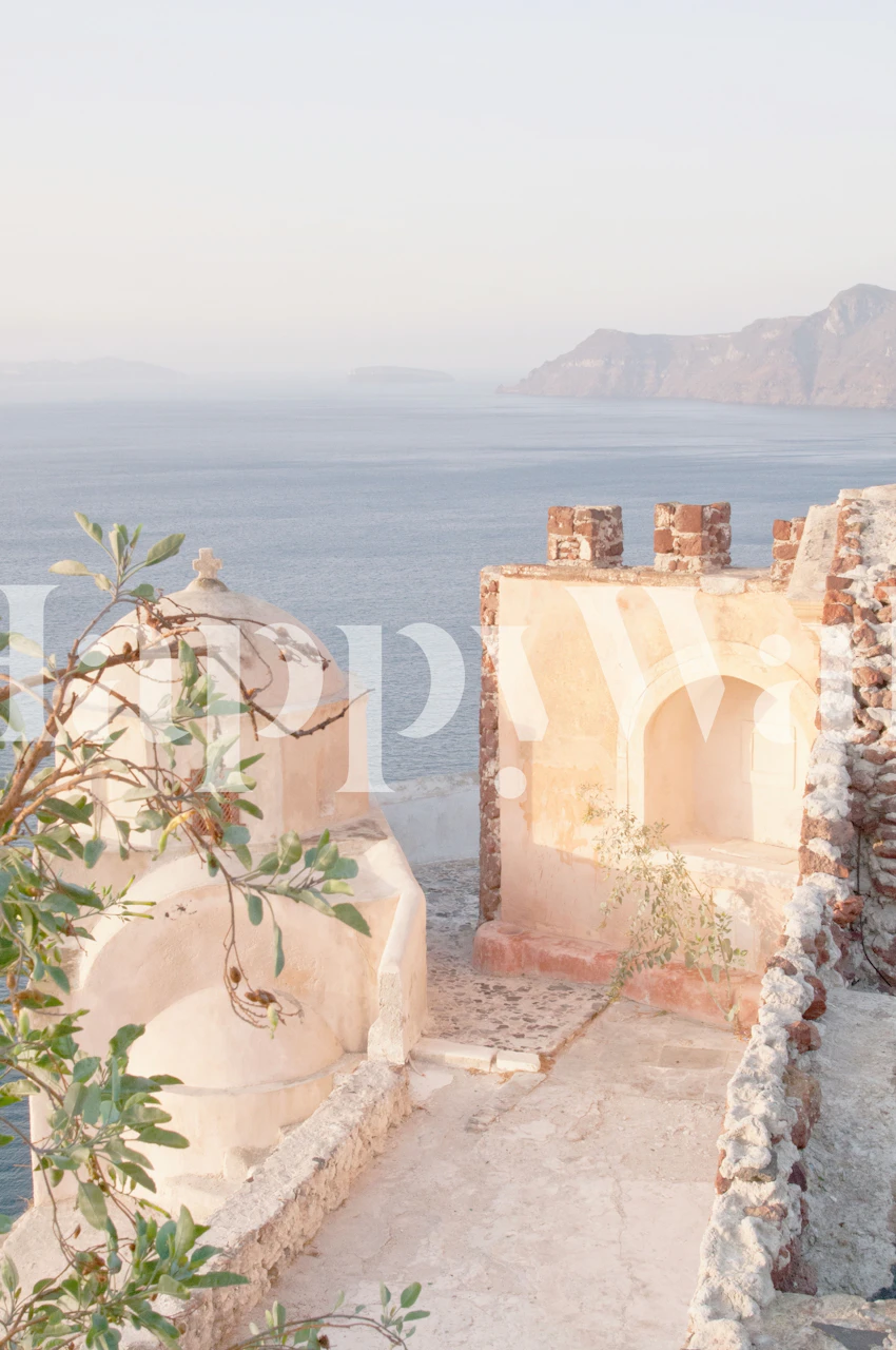 Pastel coastal view with ancient architecture and sea wallpaper