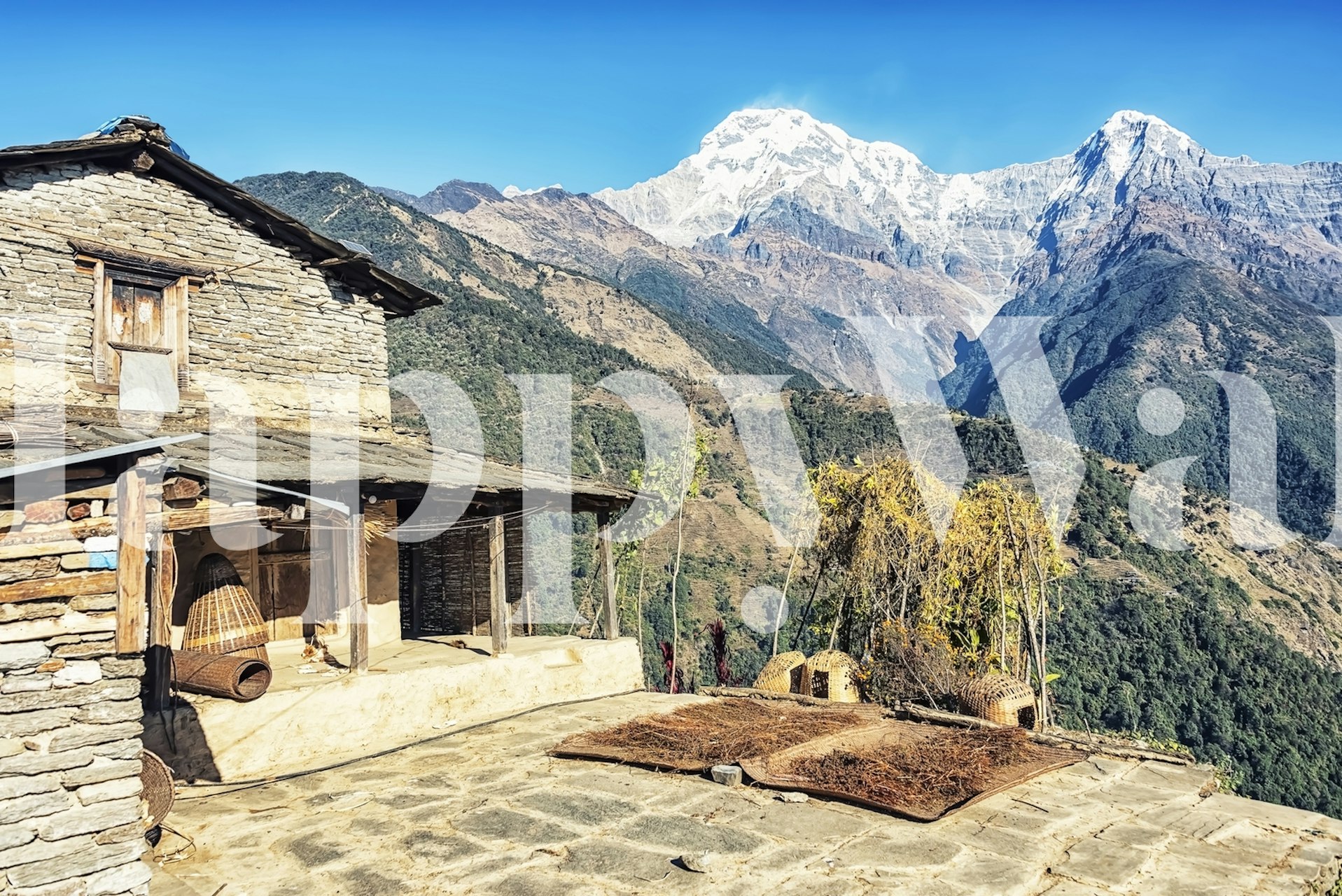 Mountain landscape with snow-capped peaks and rustic farmhouse wallpaper
