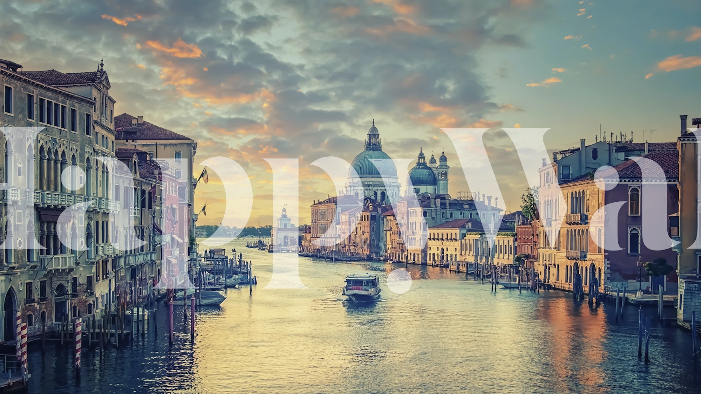 Venetian canal with buildings and soft sunrise colors wallpaper