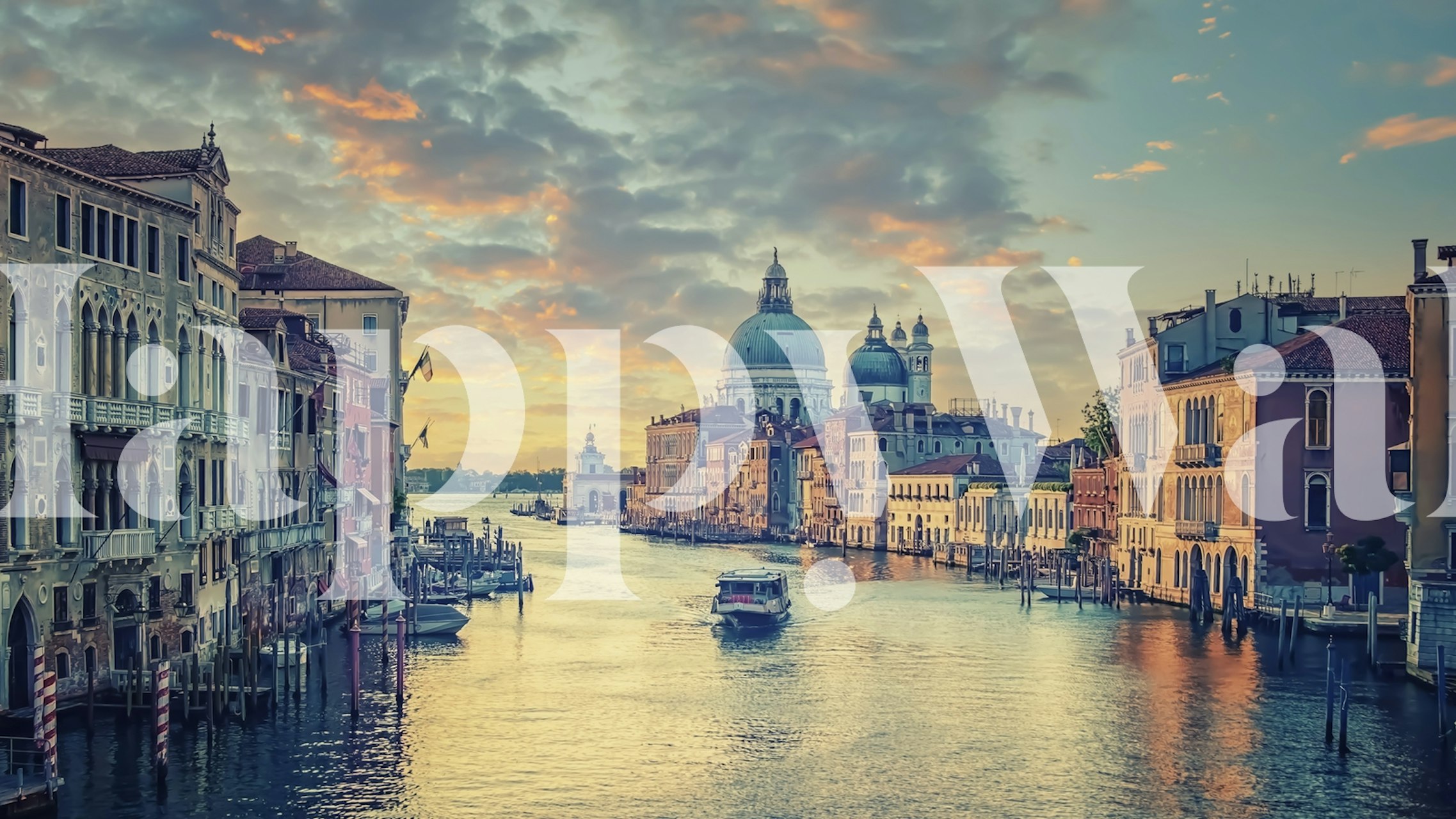 Venetian canal with buildings and soft sunrise colors wallpaper