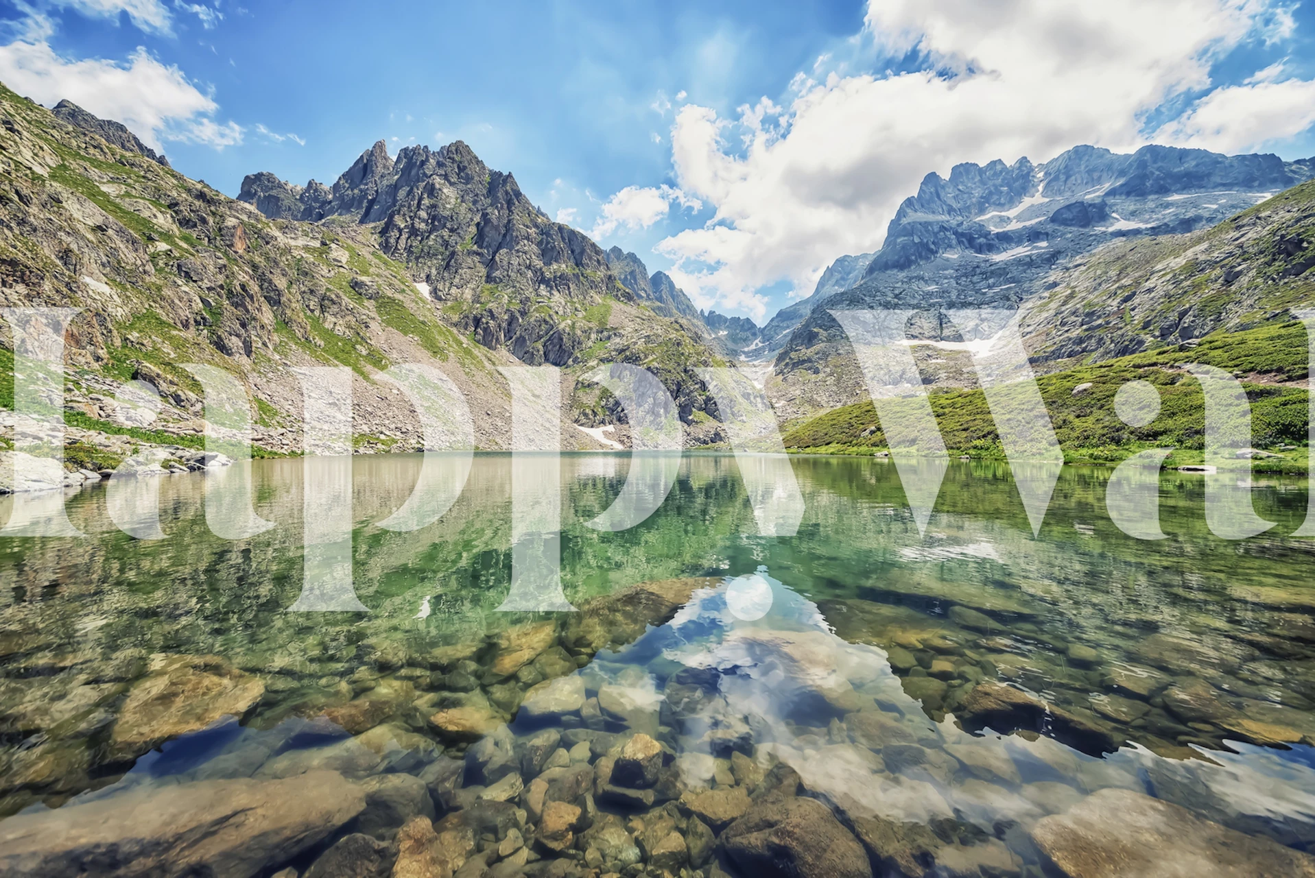 Mountain lake reflecting towering peaks and clear sky wallpaper