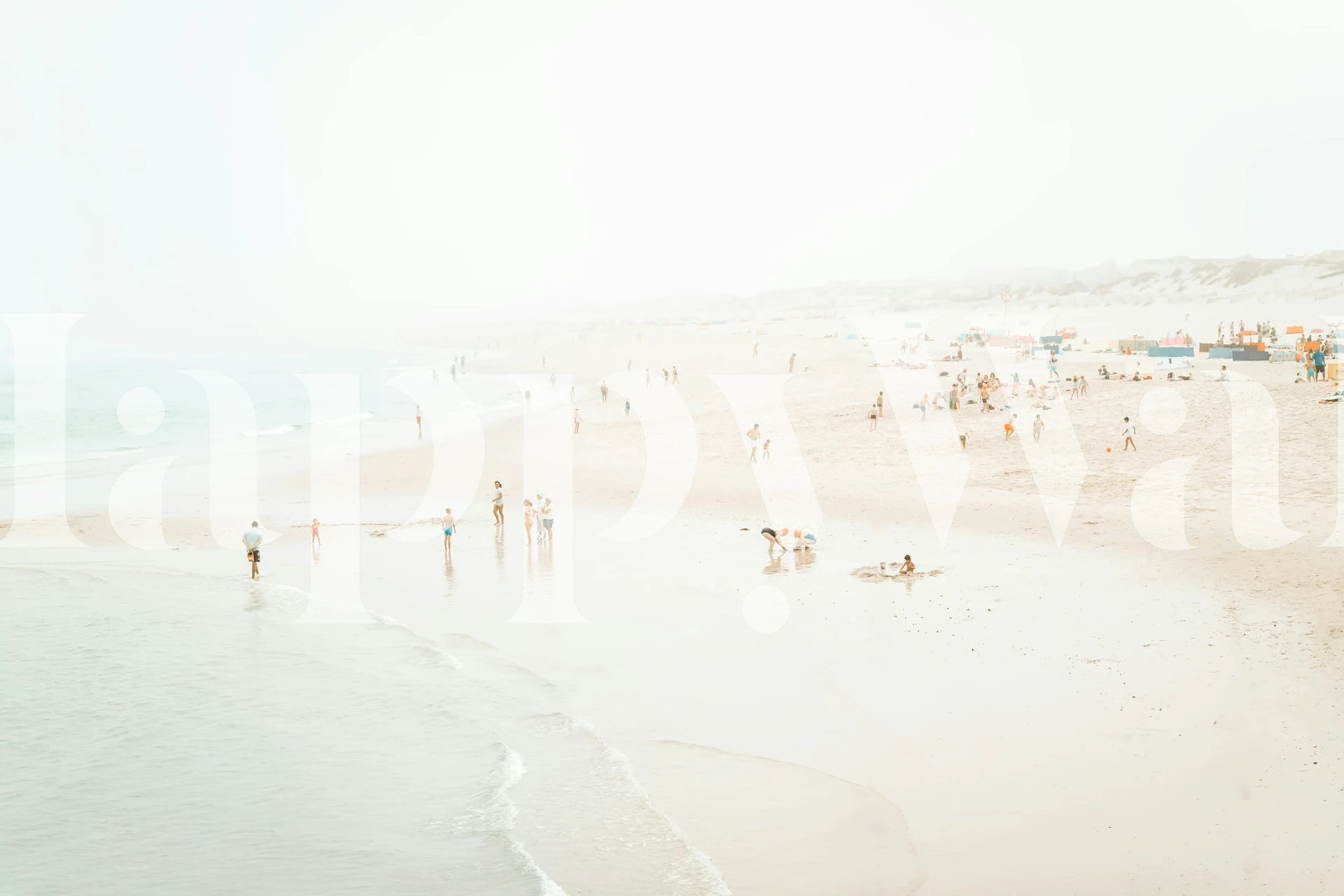 Beach scene wallpaper featuring sandy shore, ocean, and people.