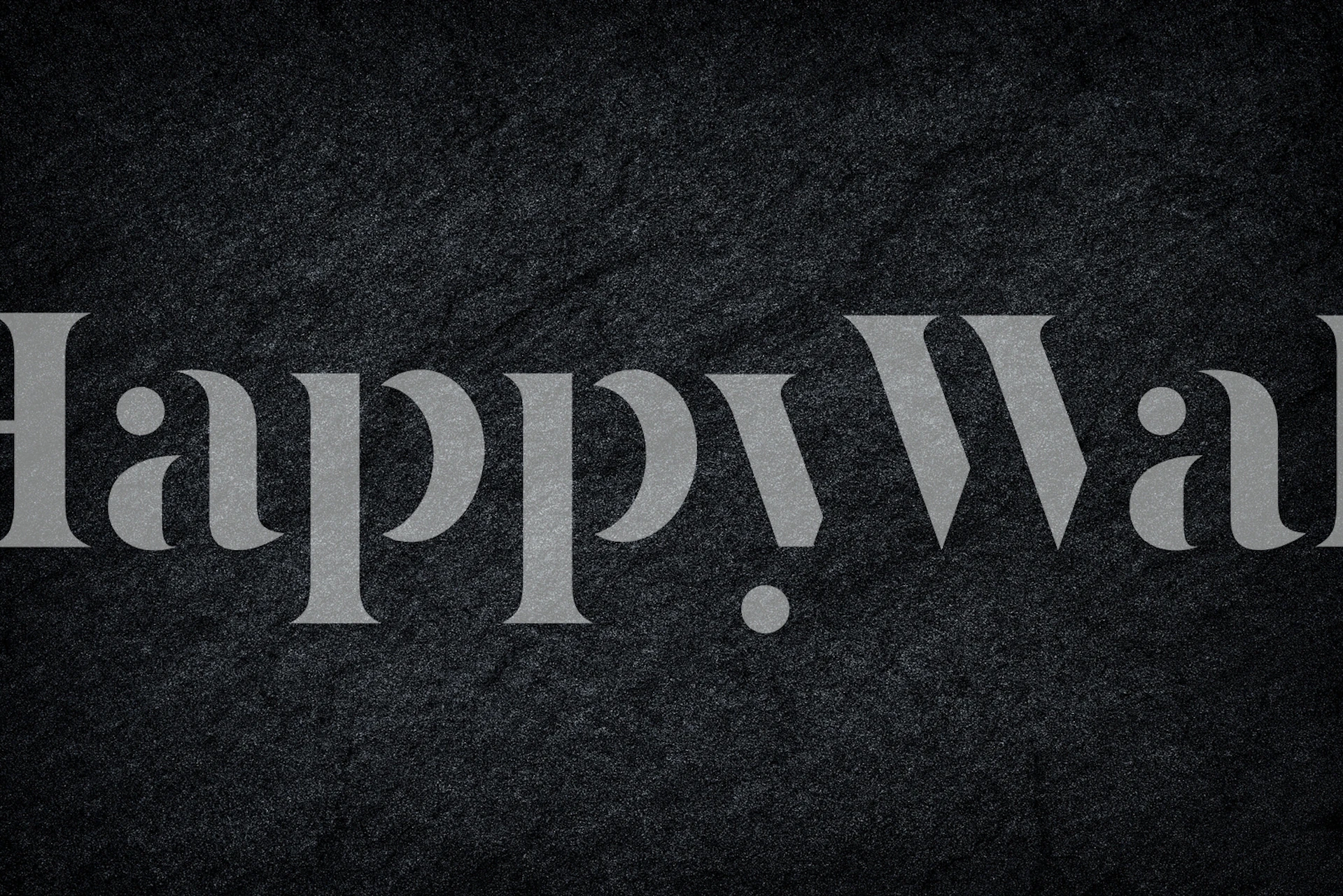 Textured dark grey and black stone wallpaper