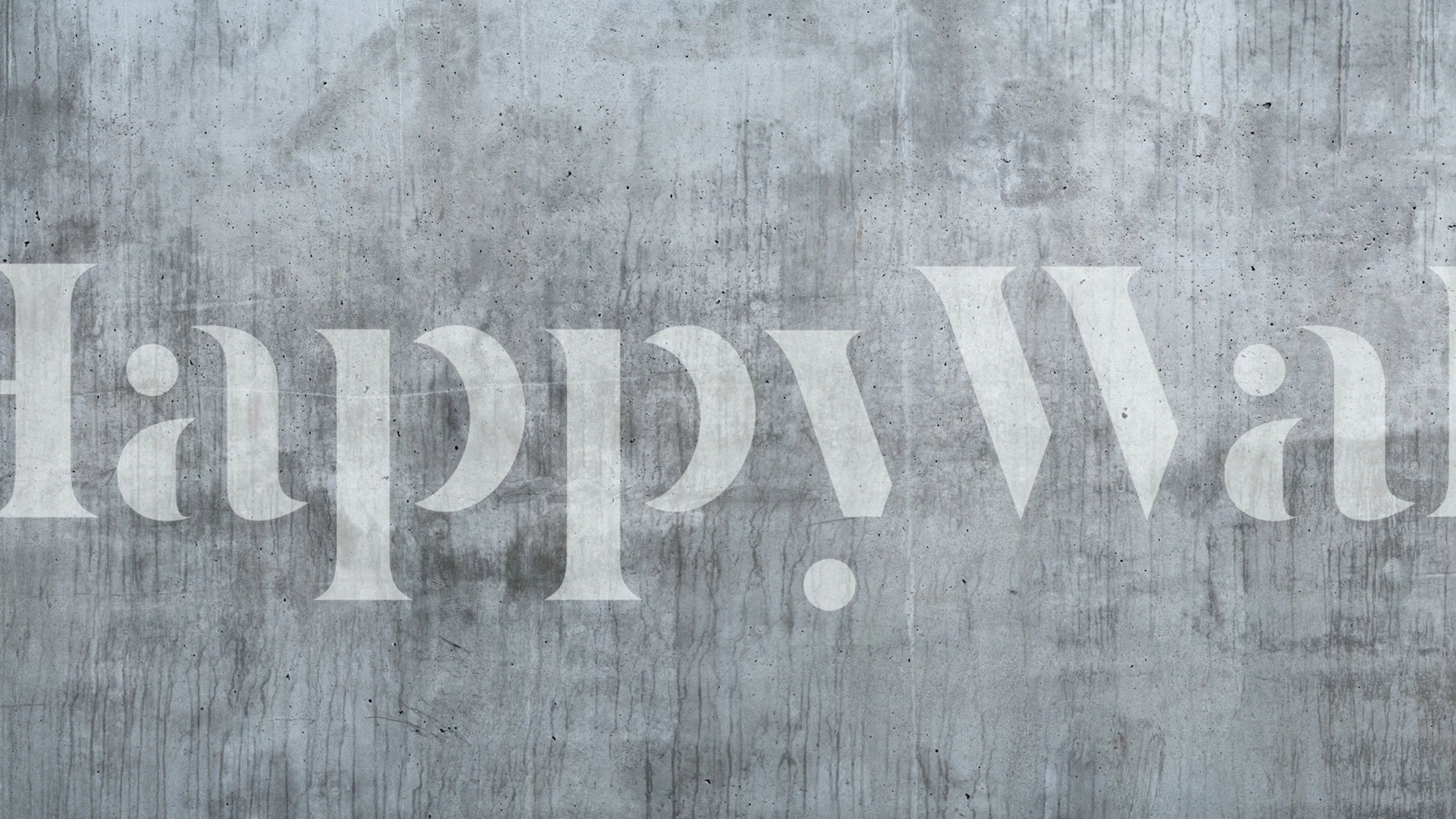 Textured gray concrete wallpaper with subtle variations