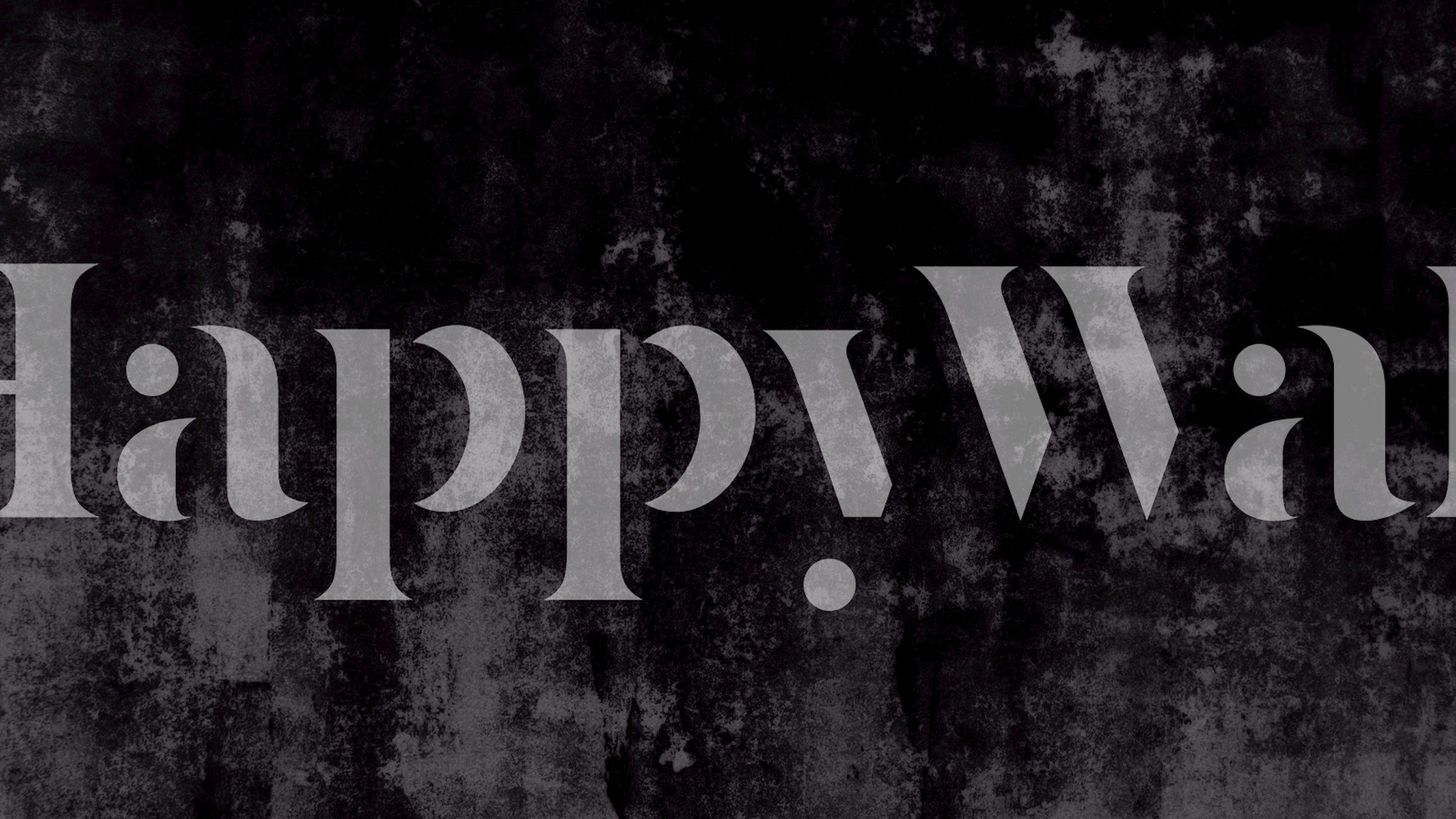 Samettimainen teksturoitu betoniseinämaalaus harmaan sävyissä