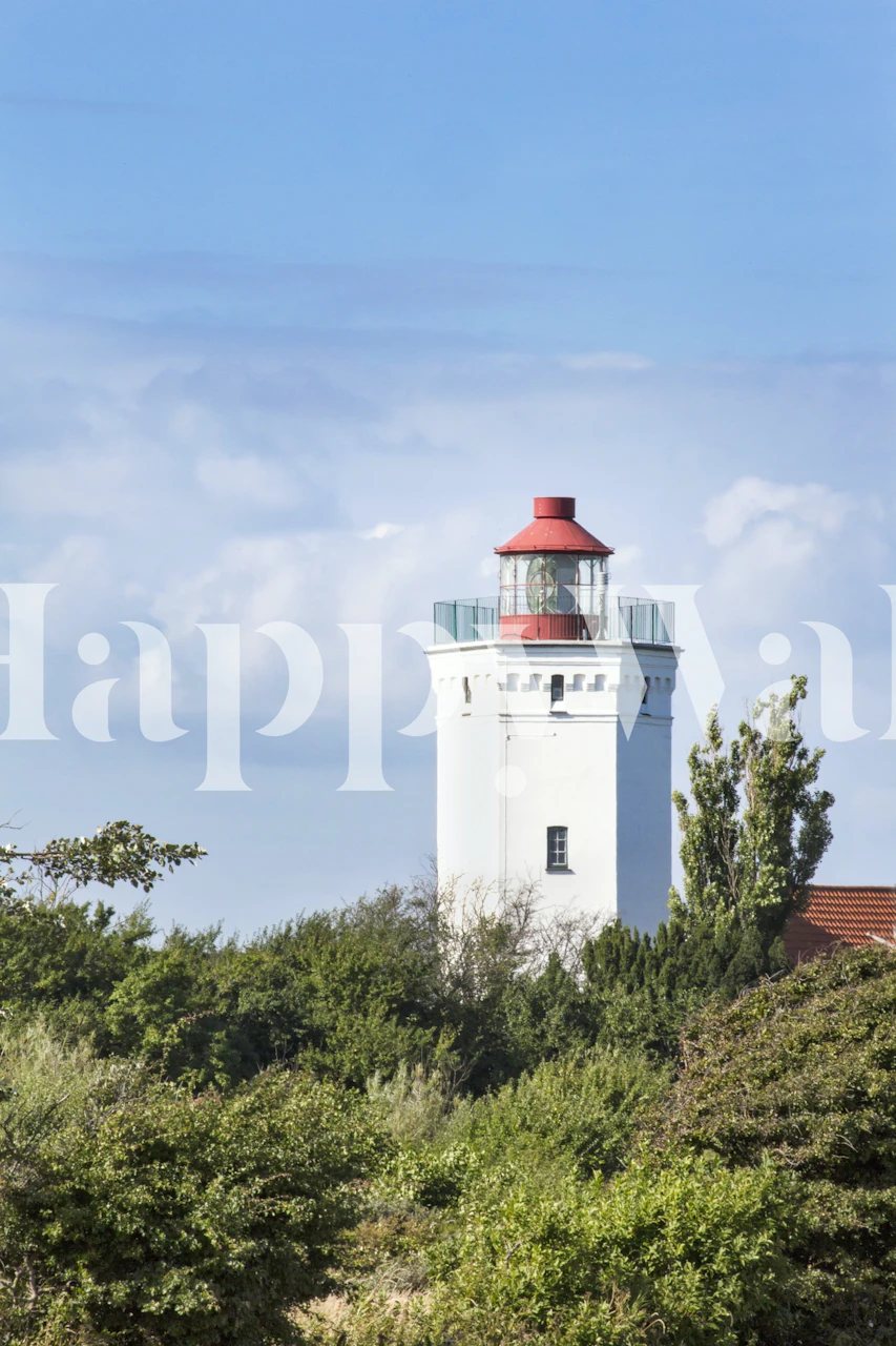 Lighthouse surrounded by greenery and blue sky wallpaper