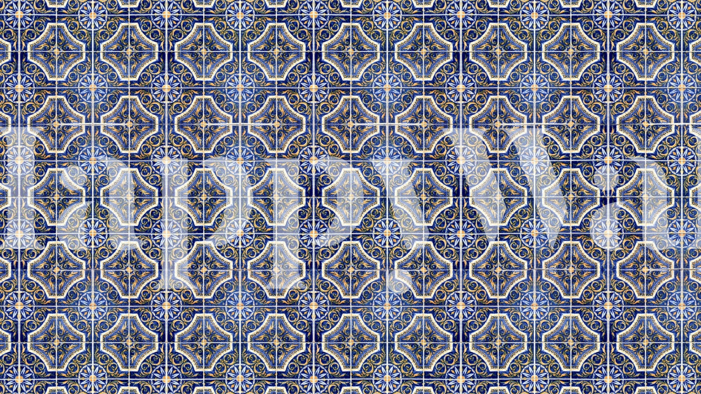 Vintage tile pattern featuring blue and yellow colors wallpaper
