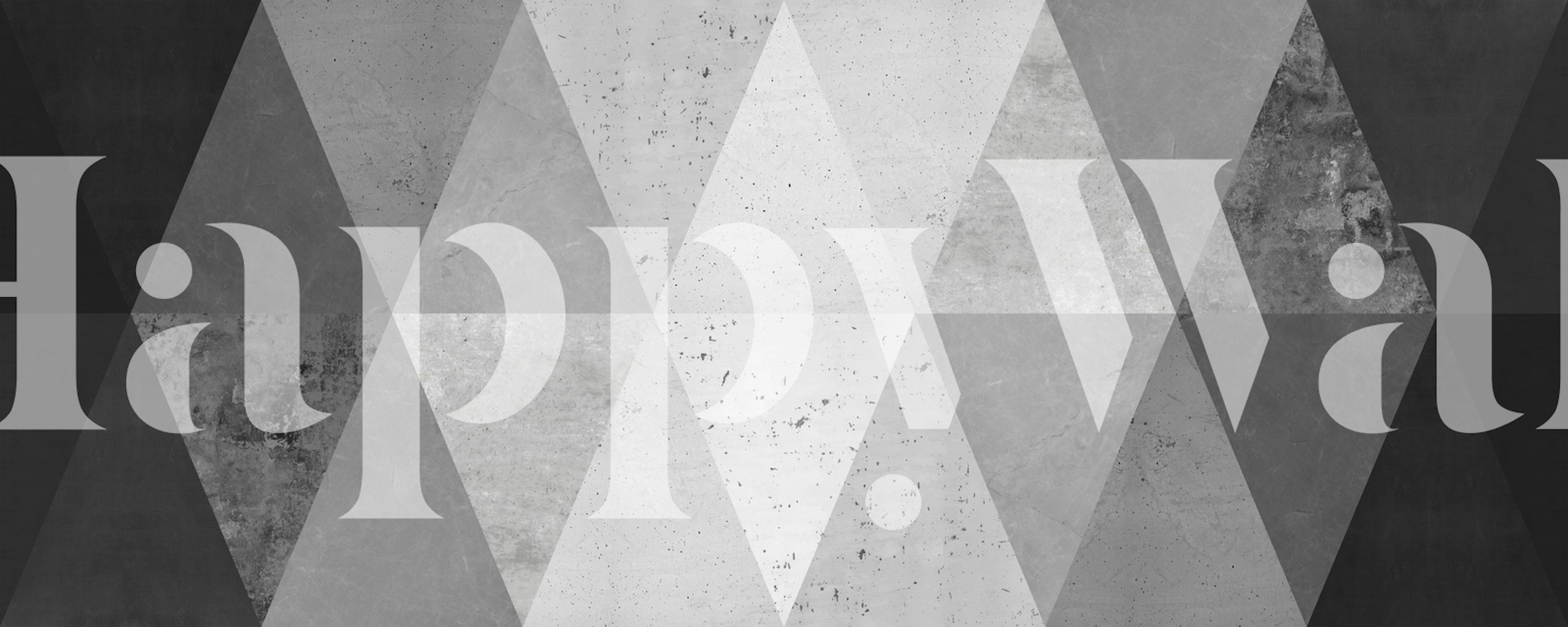 Black and white geometric pattern wallpaper featuring triangular shapes and varying textures.