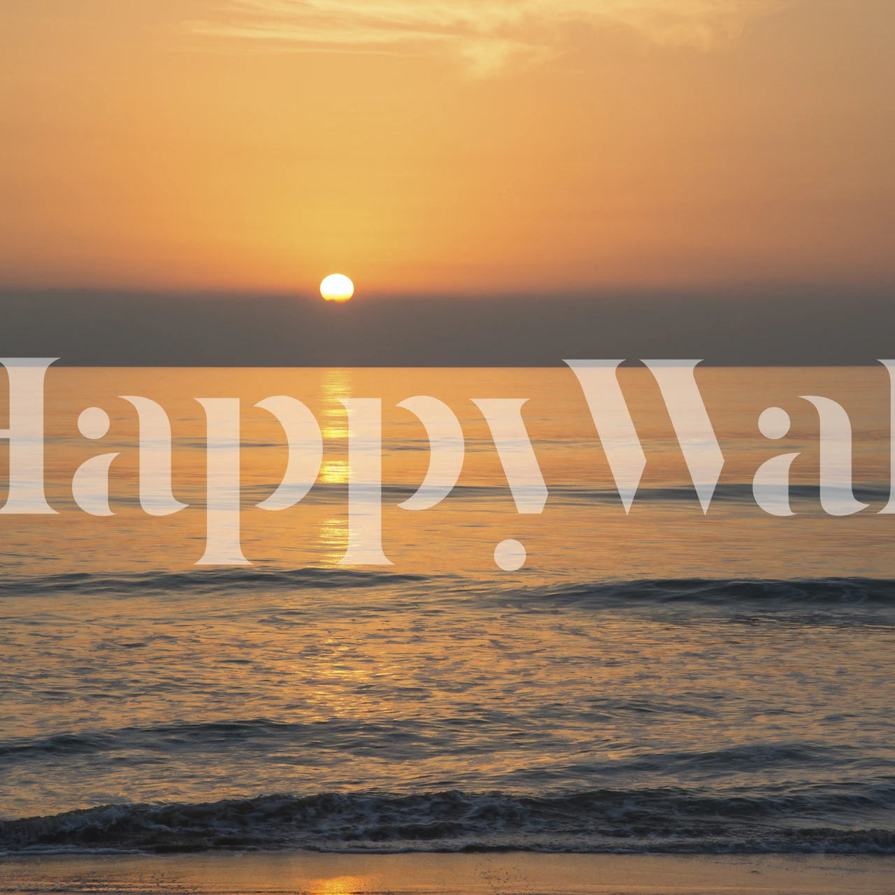 Sunset over calm ocean water with orange and yellow hues wallpaper