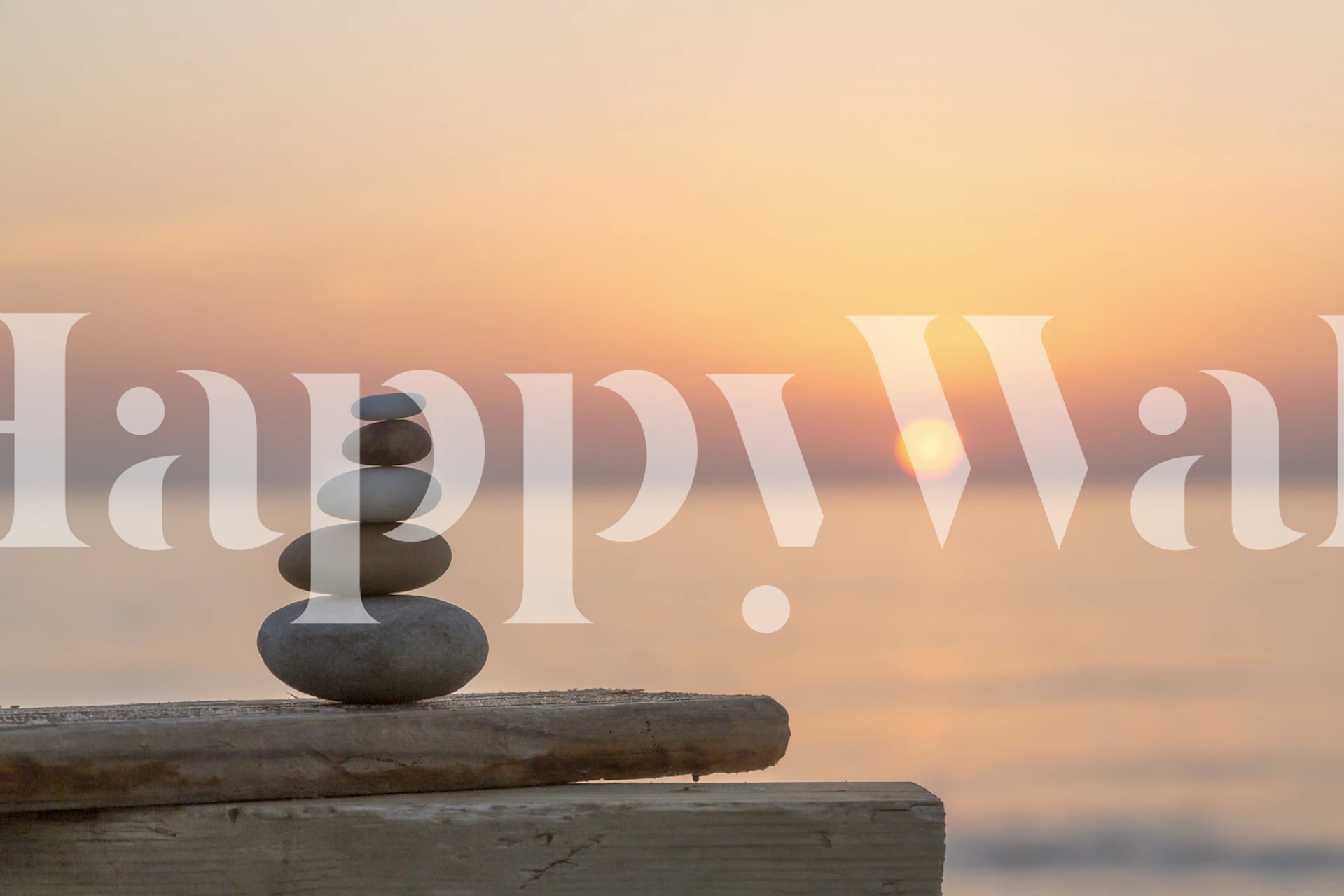 Stacked stones silhouetted by a sunset on a Sunset Rock Balancing wall mural.