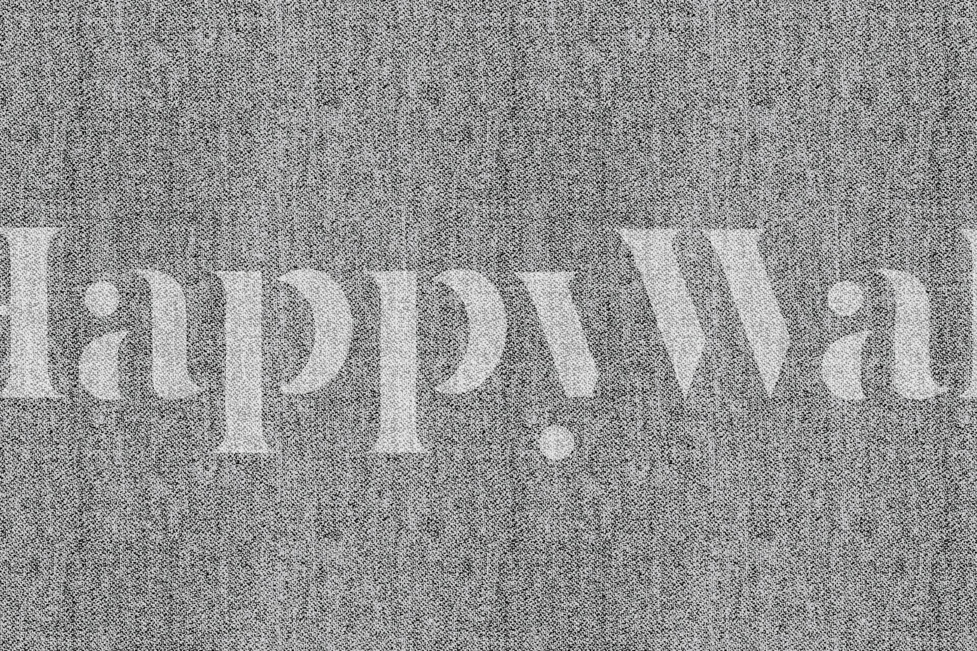 Greyish textile wallpaper in a room setting