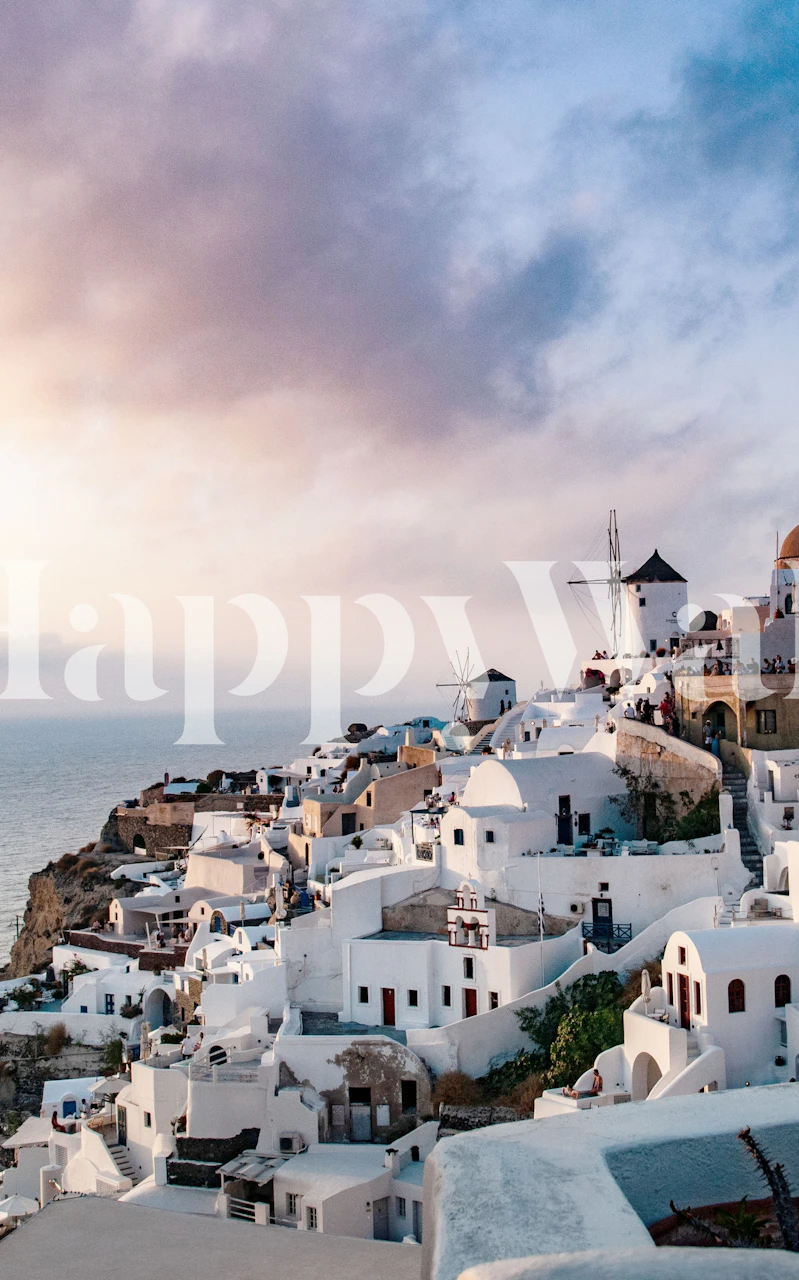 Santorini white buildings against sunset sky wallpaper