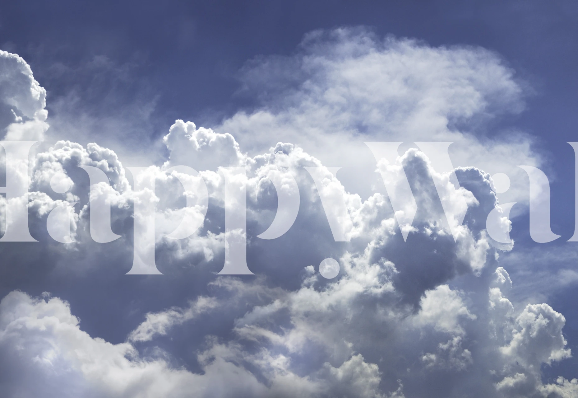 Fluffy white clouds against a blue sky wallpaper