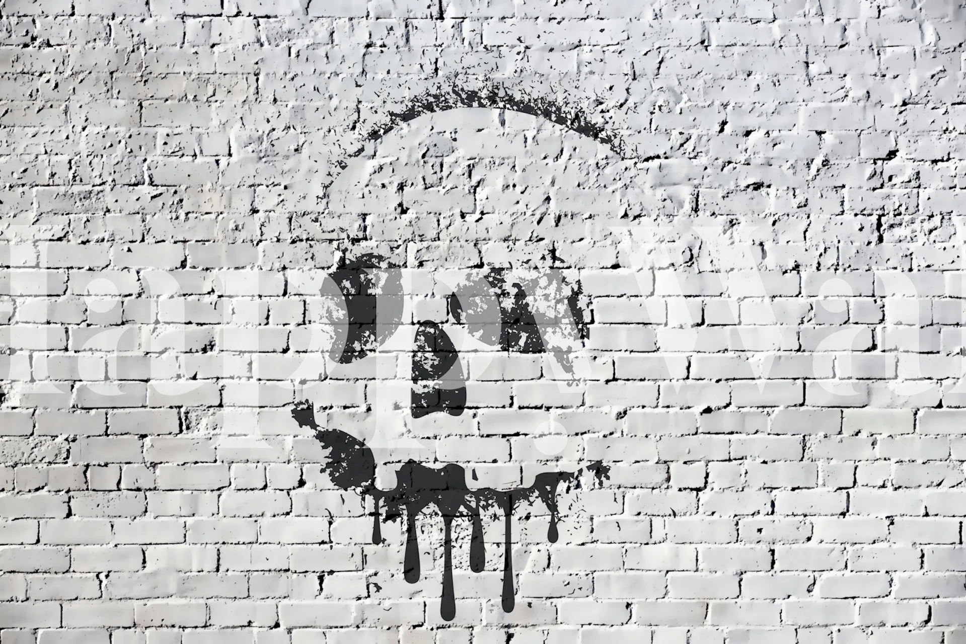 Skull design in black paint on a white brick wall wallpaper