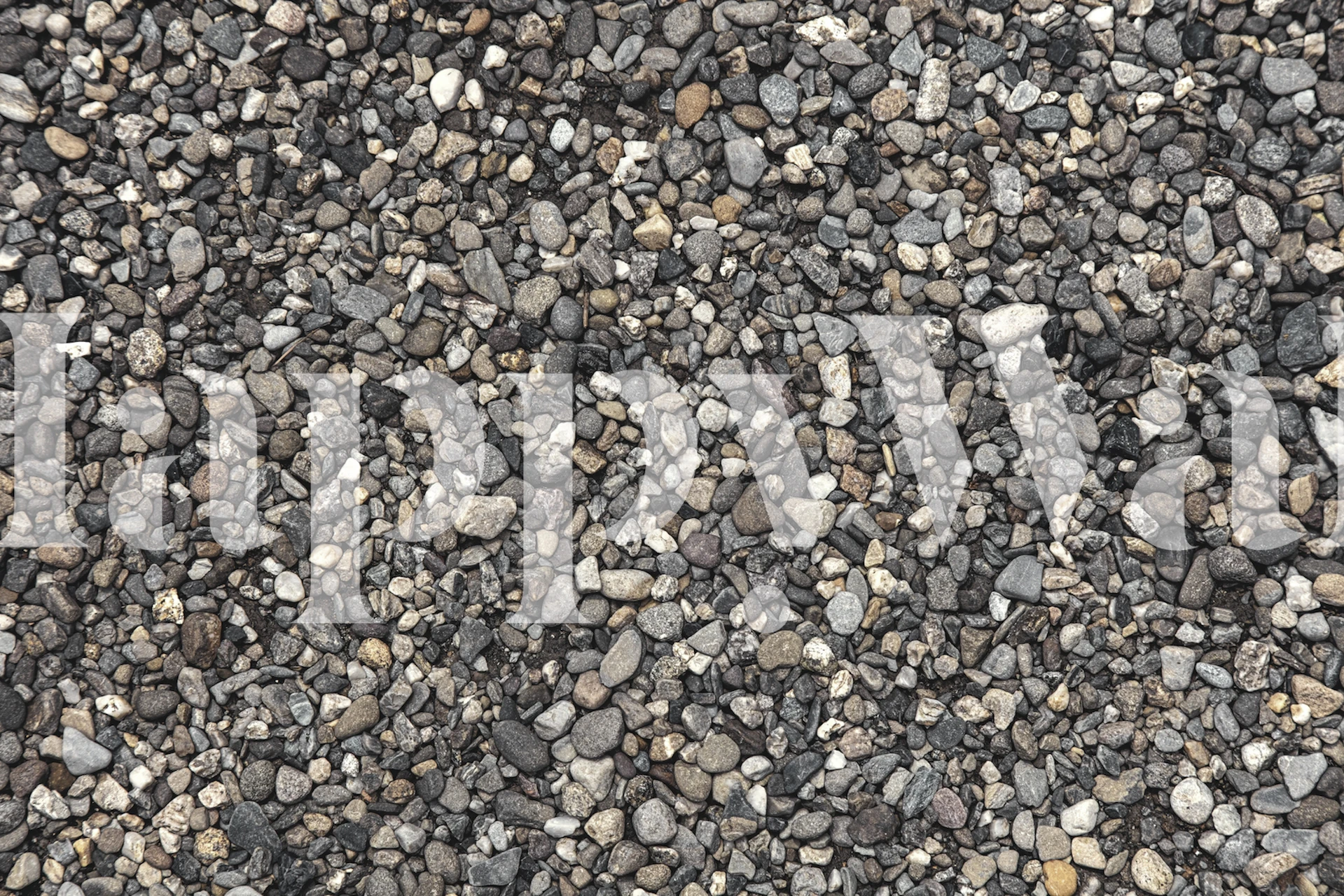 Fotomural de guijarros lisos en tonos grises, negros y blancos, imitando las playas de guijarros de Positano.