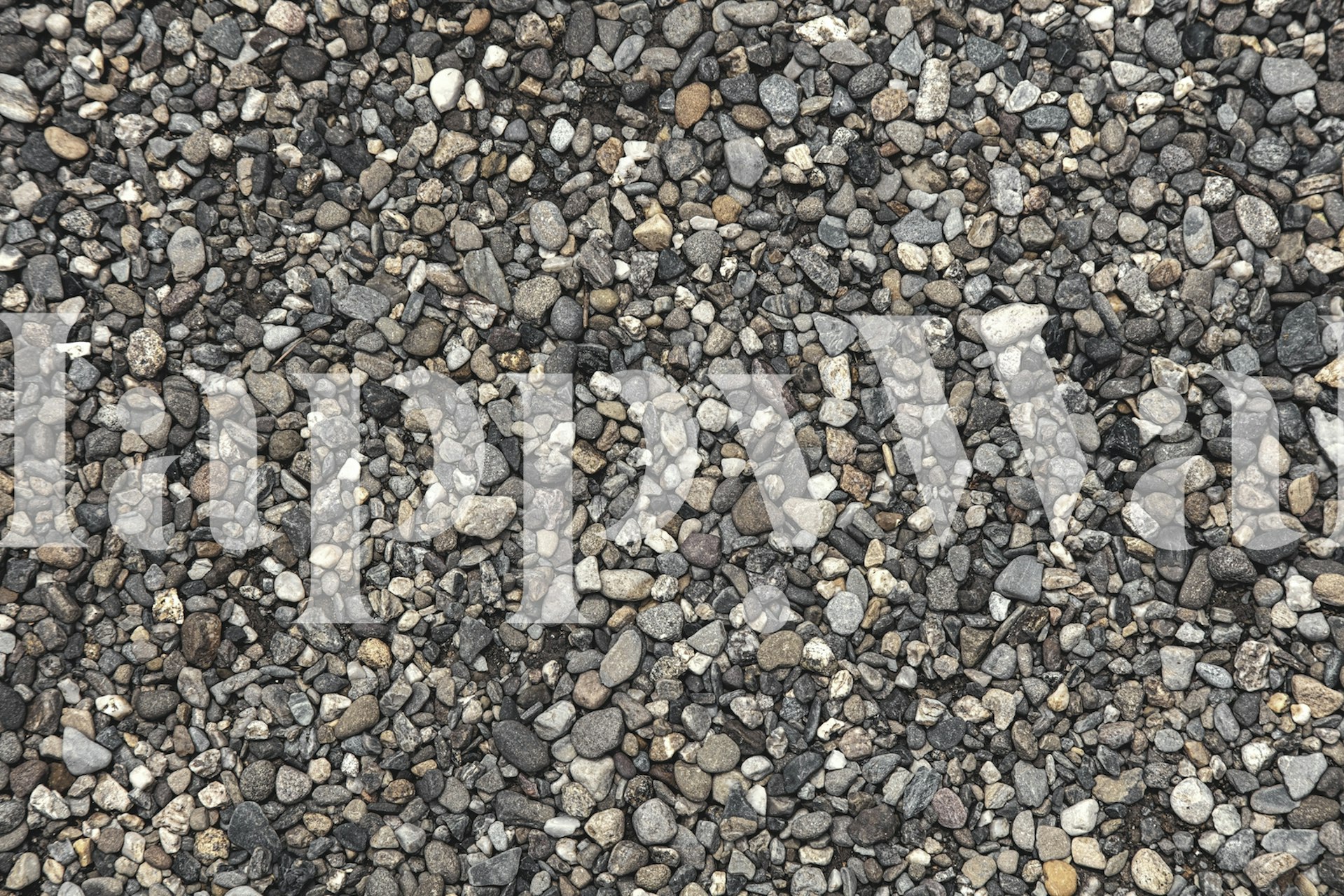 Fotobehang van gladde kiezelstenen in de kleuren grijs, zwart en wit, die de kiezelstranden van Positano nabootsen.
