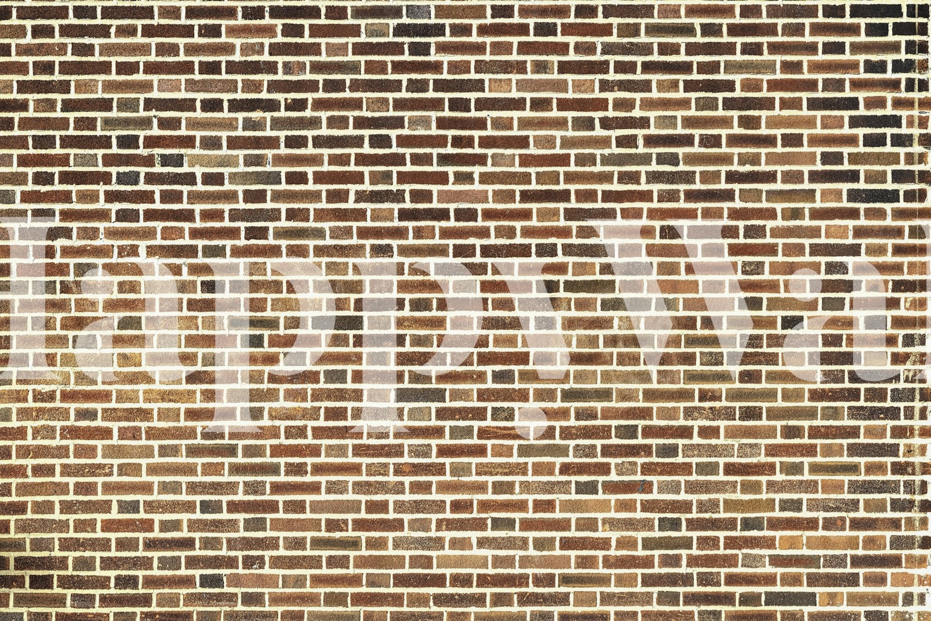 Brown brick wall with varying shades and textures wallpaper