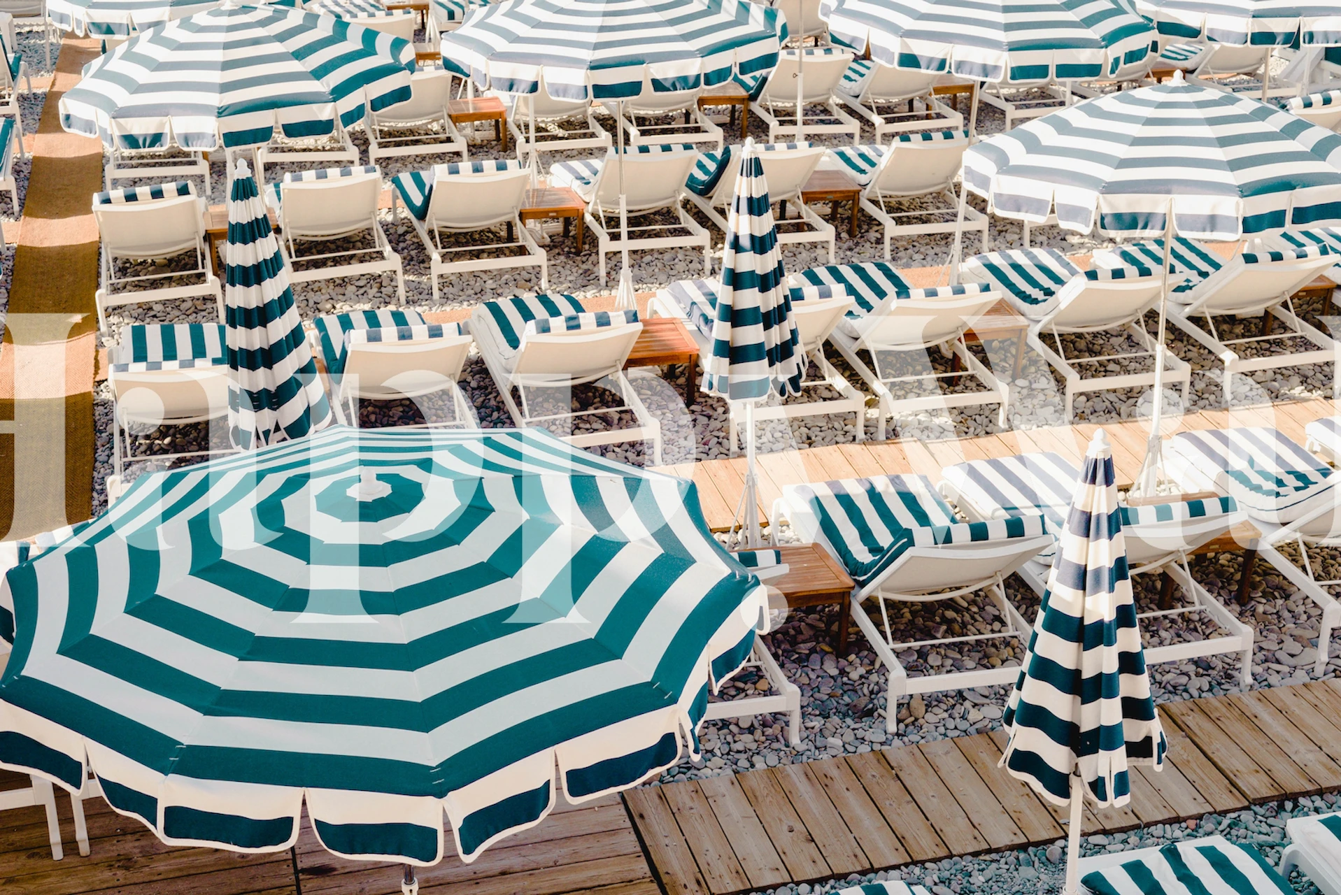 Striped beach umbrellas wallpaper in a room