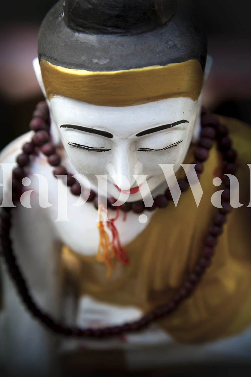 Golden Buddha statue wall mural with peaceful expression and traditional adornments.