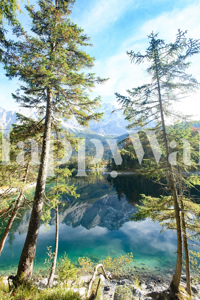 Mountain lake scene wallpaper with green trees and blue reflection