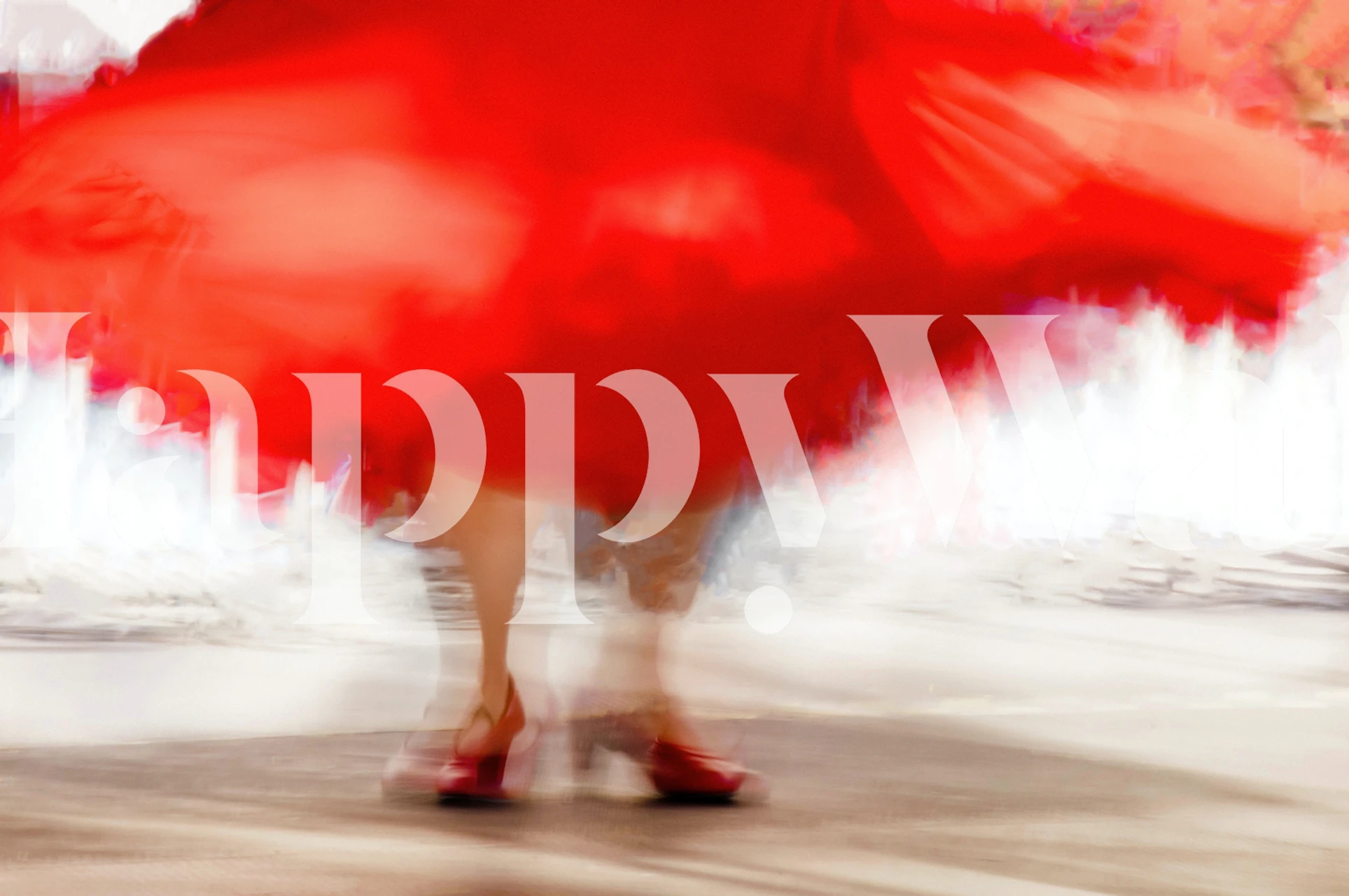 Blurry image of a flamenco dancer's red dress in motion, capturing the essence of Spanish dance.