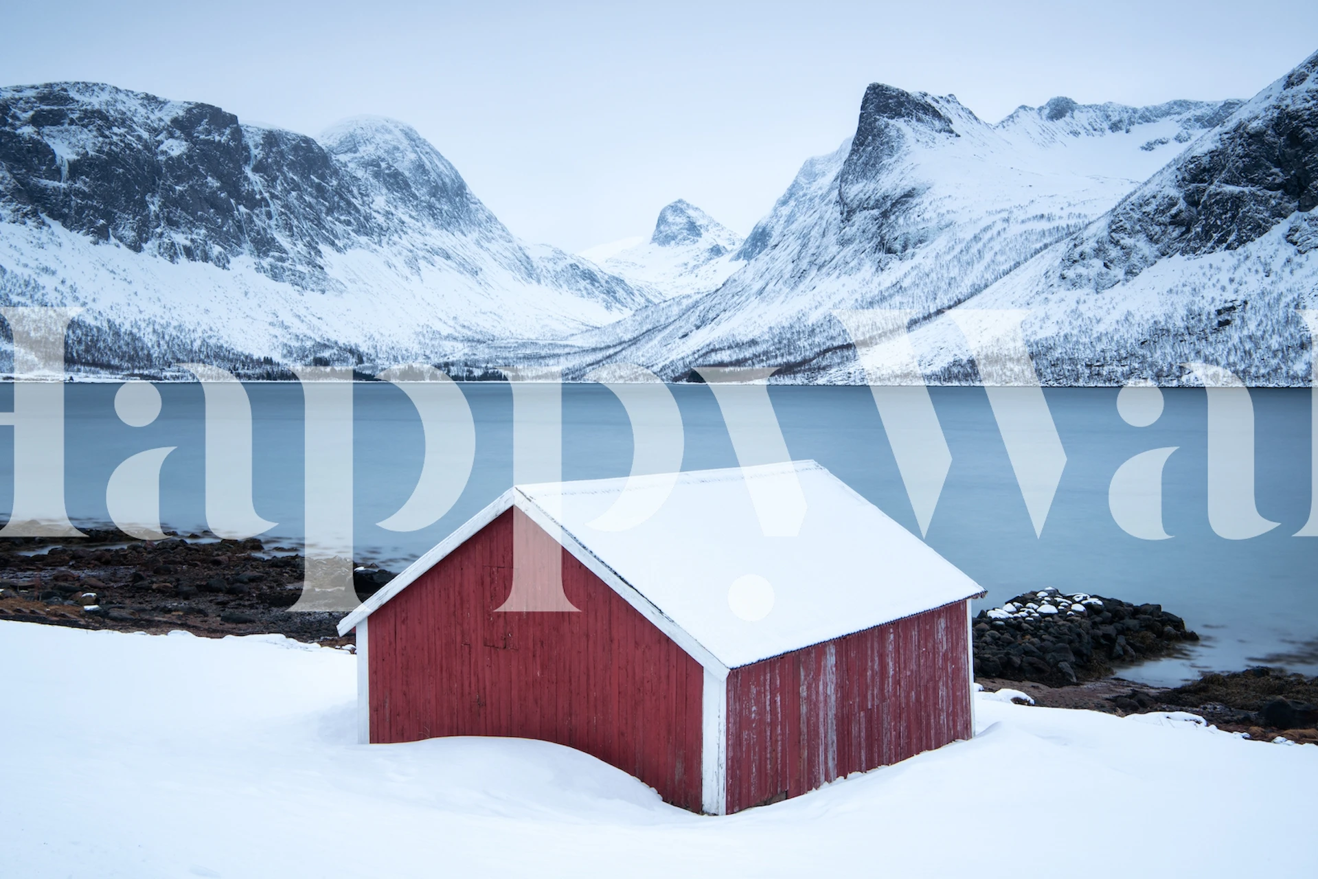 Red cabin in snowy landscape with mountains wallpaper