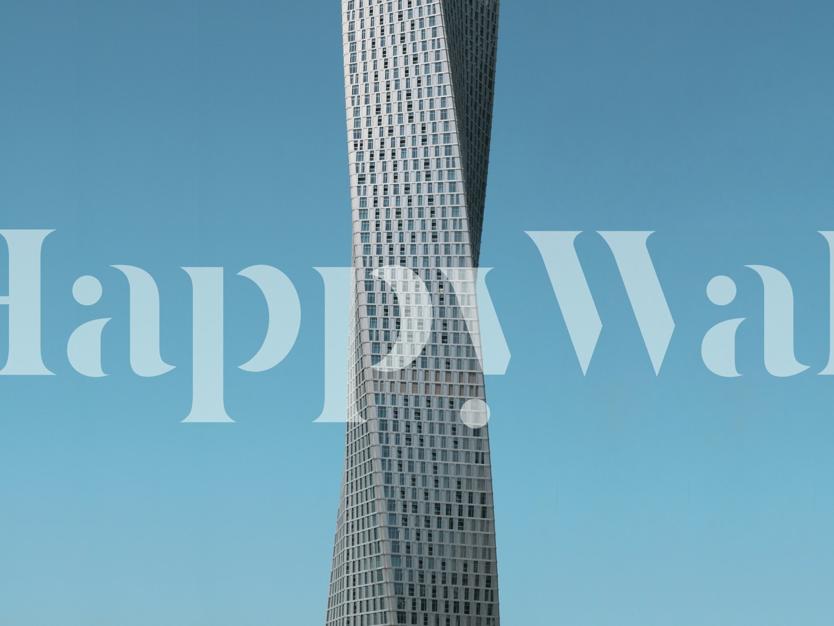 Architectural twisted tower against blue sky wallpaper