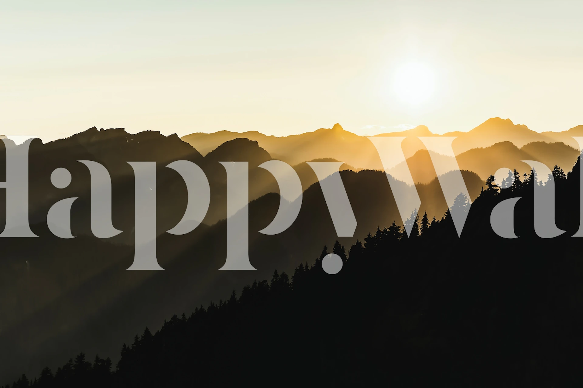 mountains silhouetted against a sunset with golden rays wallpaper