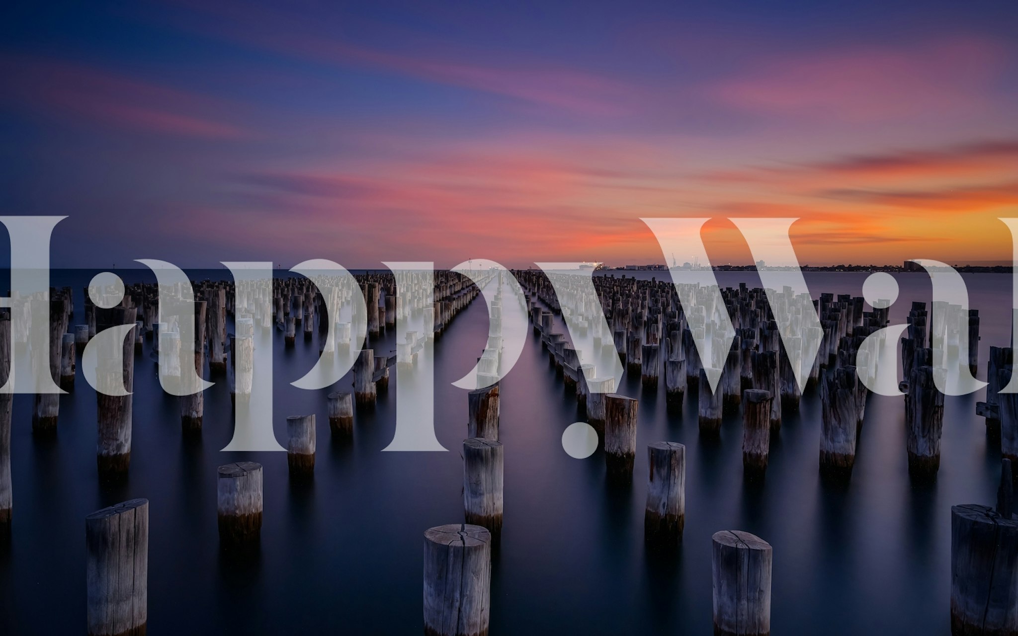 Princes Pier at sunset with colorful sky and wooden pillars