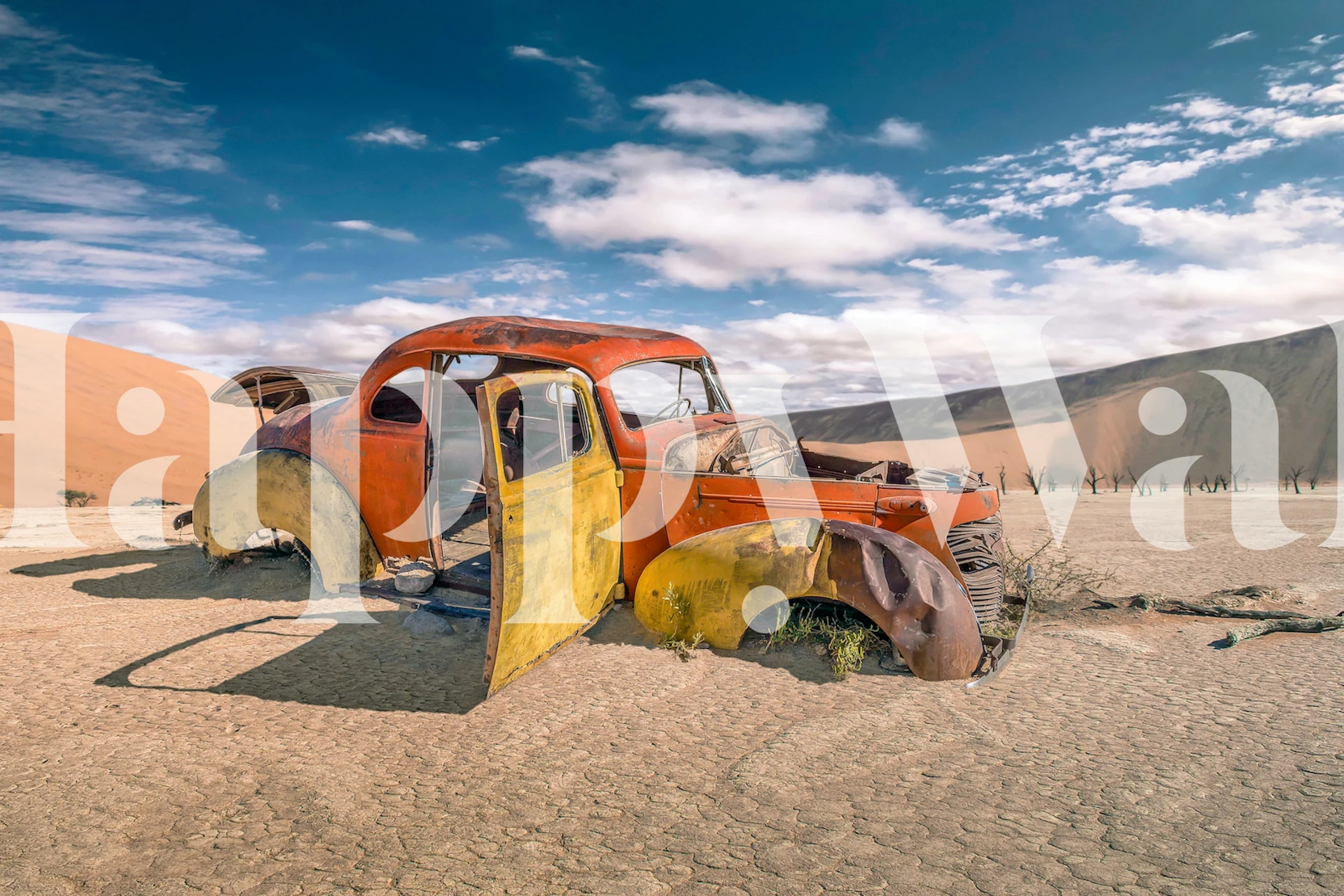 Vintage abandoned car in desert wall mural