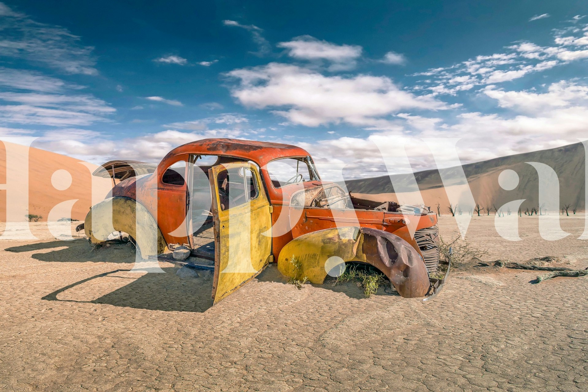 Vintage abandoned car in desert wall mural