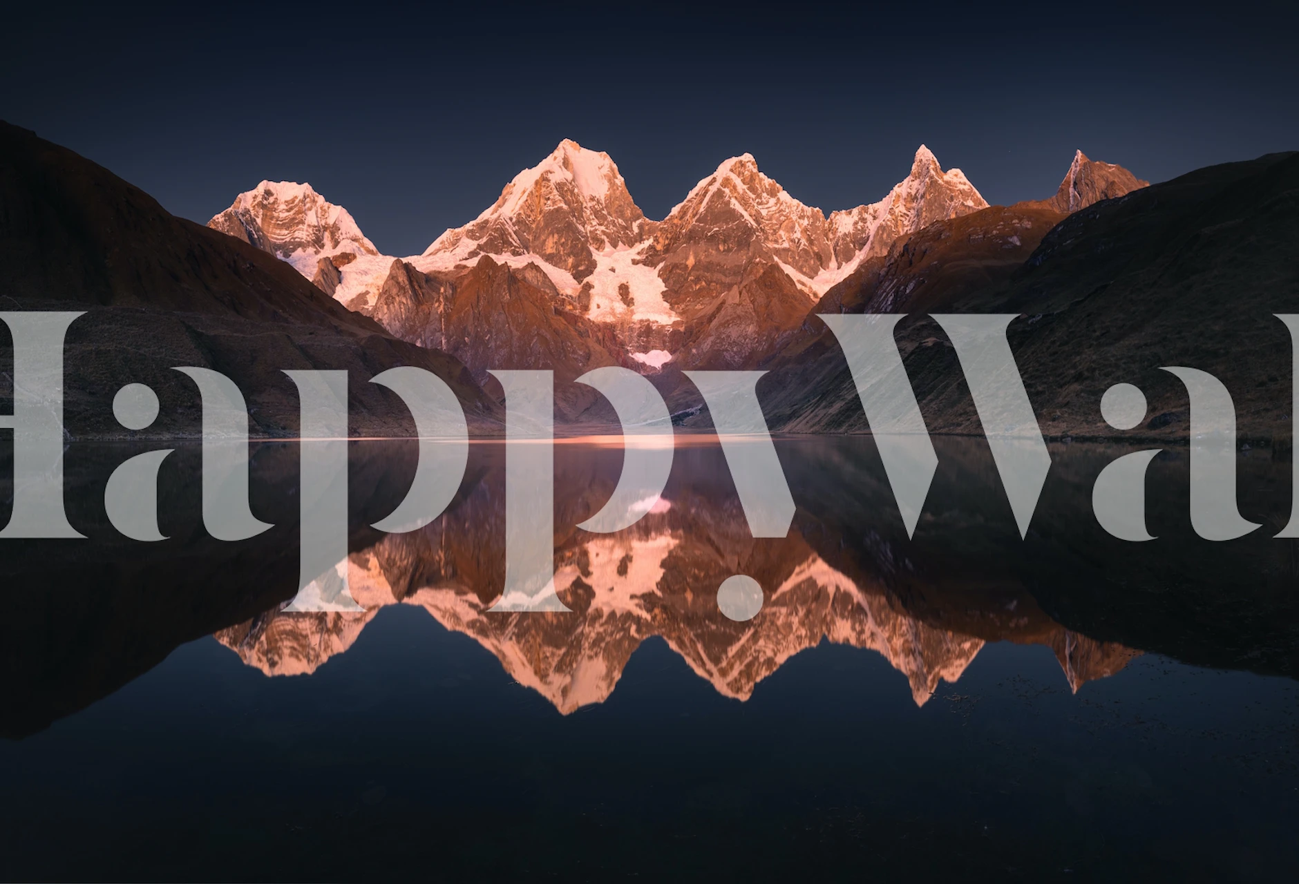 Snow-capped mountains reflecting on a lake wallpaper