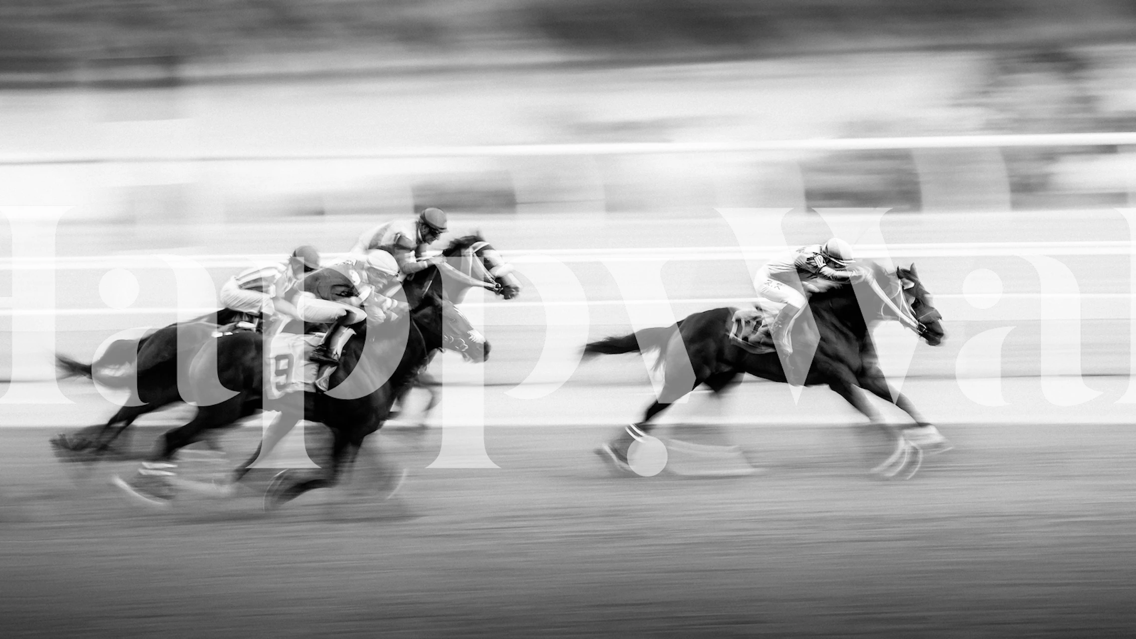Black and white wallpaper depicting a horse race with blurred motion